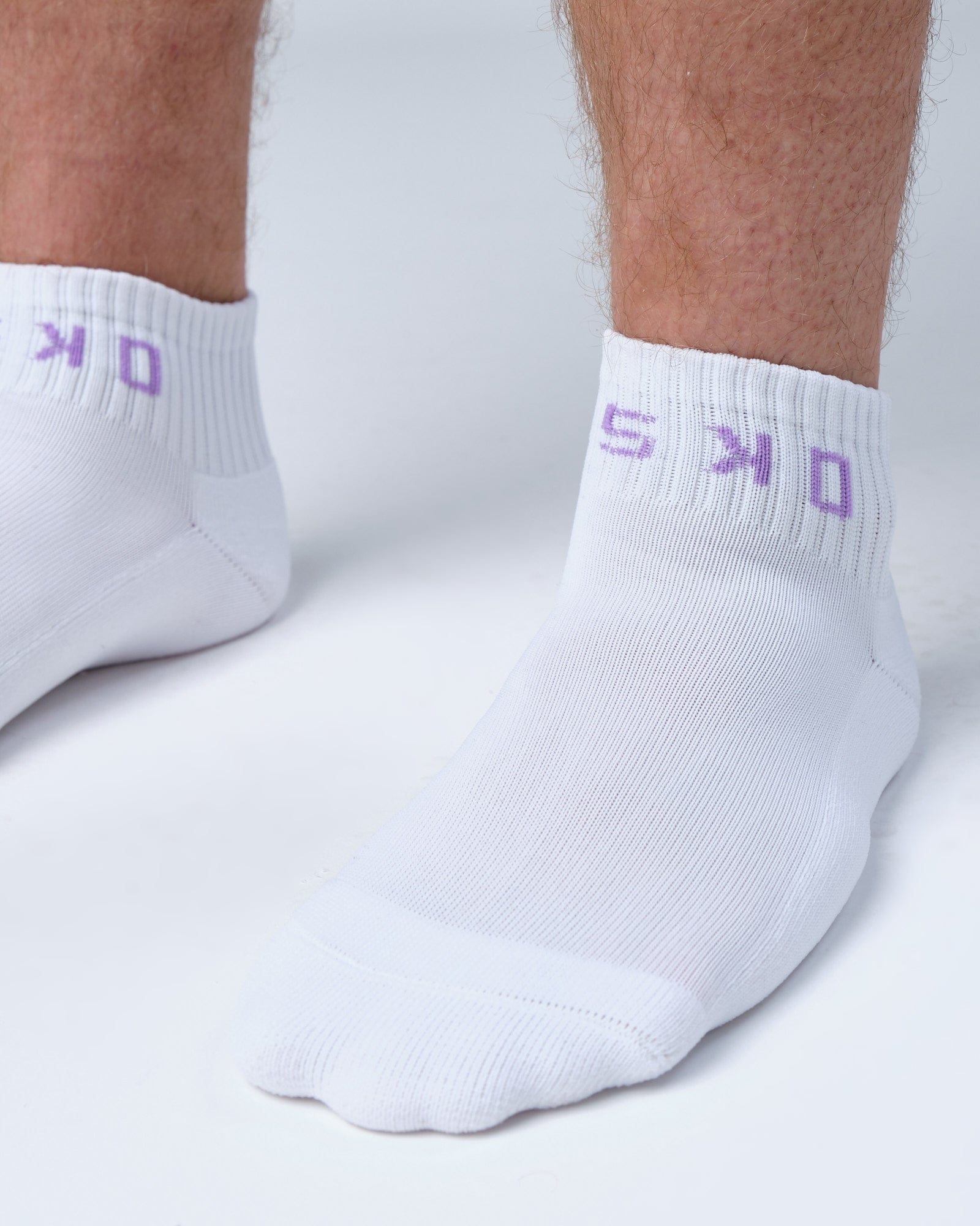 Model wearing Base Quarter Sock - White-Cosmic Sky