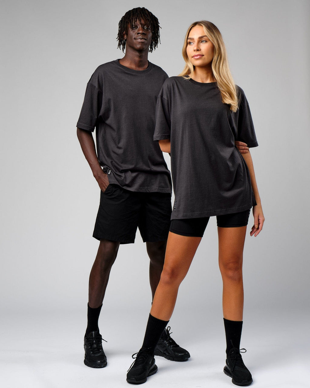 Model wearing Unisex Span Tee Oversize - Phantom