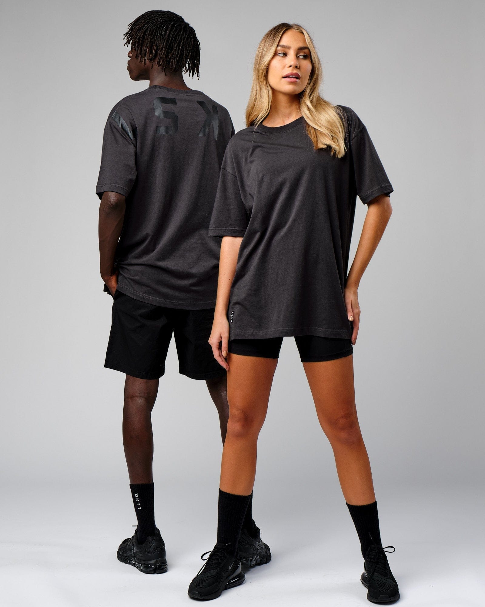 Model wearing Unisex Span Tee Oversize - Phantom