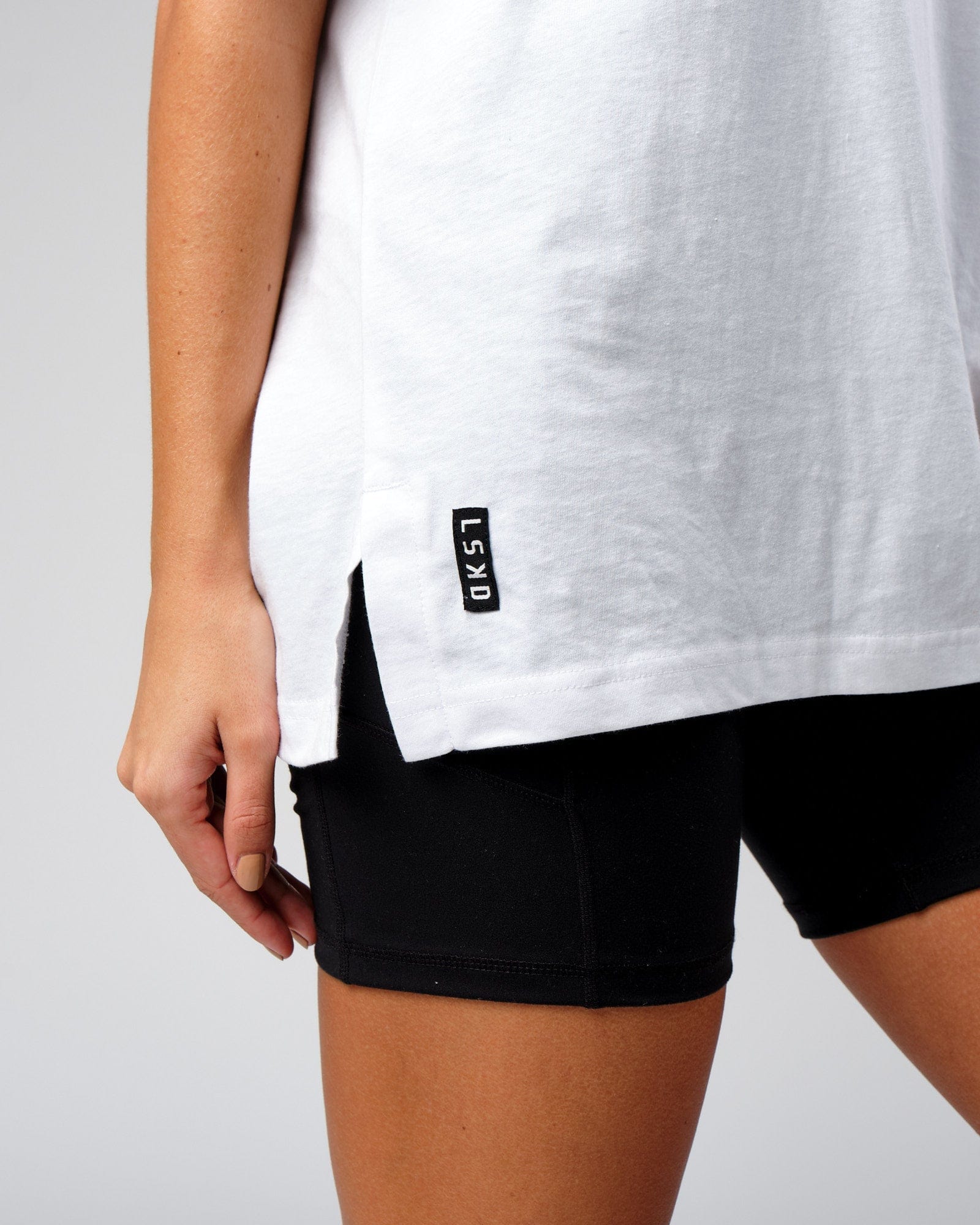 Model wearing Unisex Span Tee Oversize - White