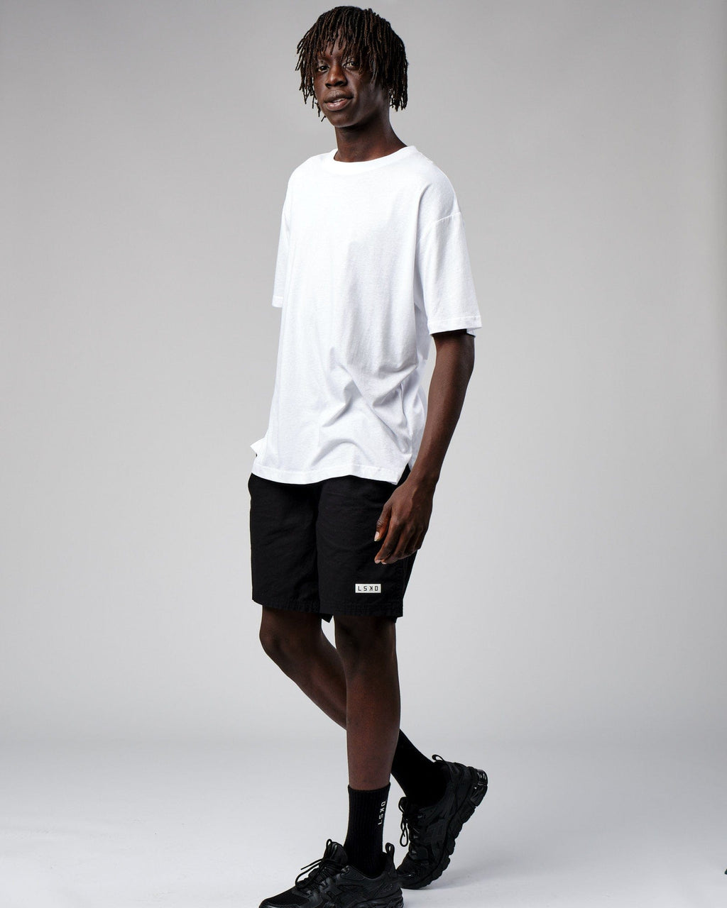 Model wearing Span Tee Oversize - White