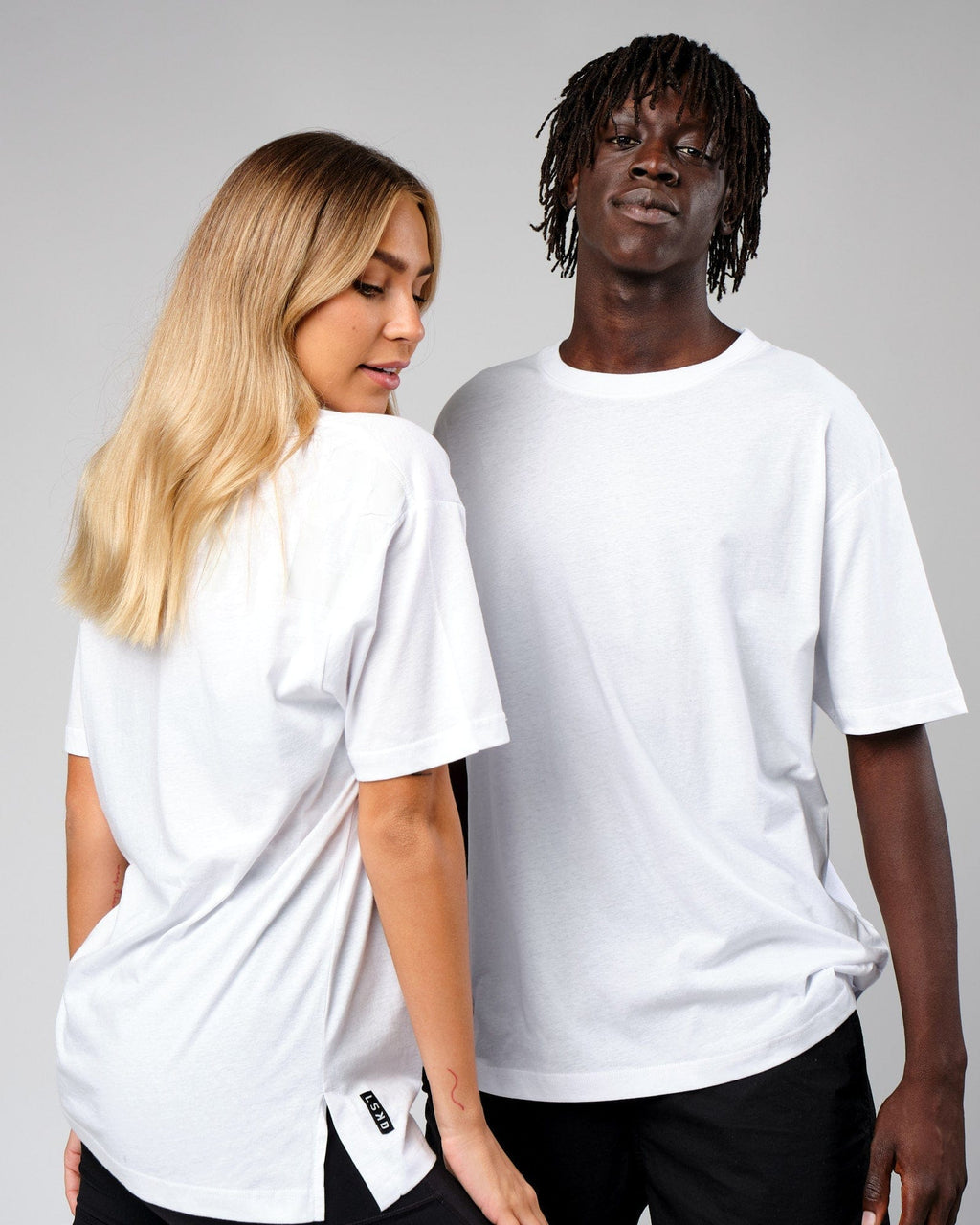 Model wearing Unisex Span Tee Oversize - White