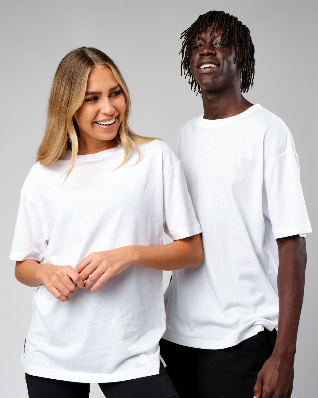Model wearing Unisex Span Tee Oversize - White