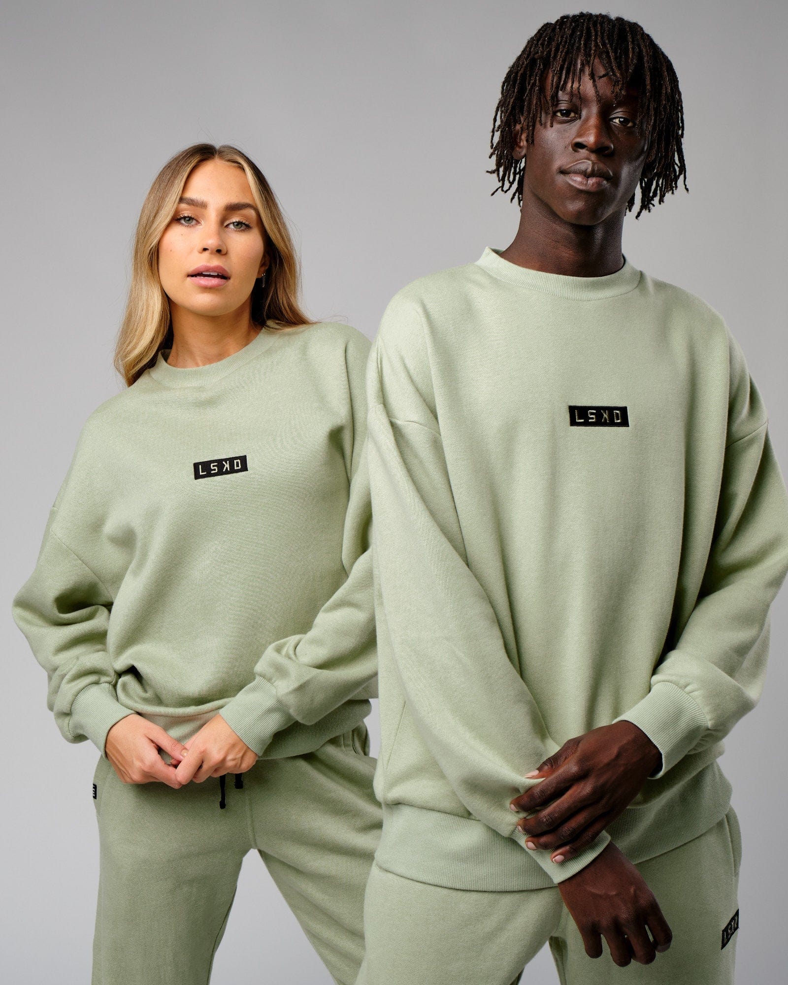 Model wearing Unisex Cornerstone Sweater Oversize - Desert Sage