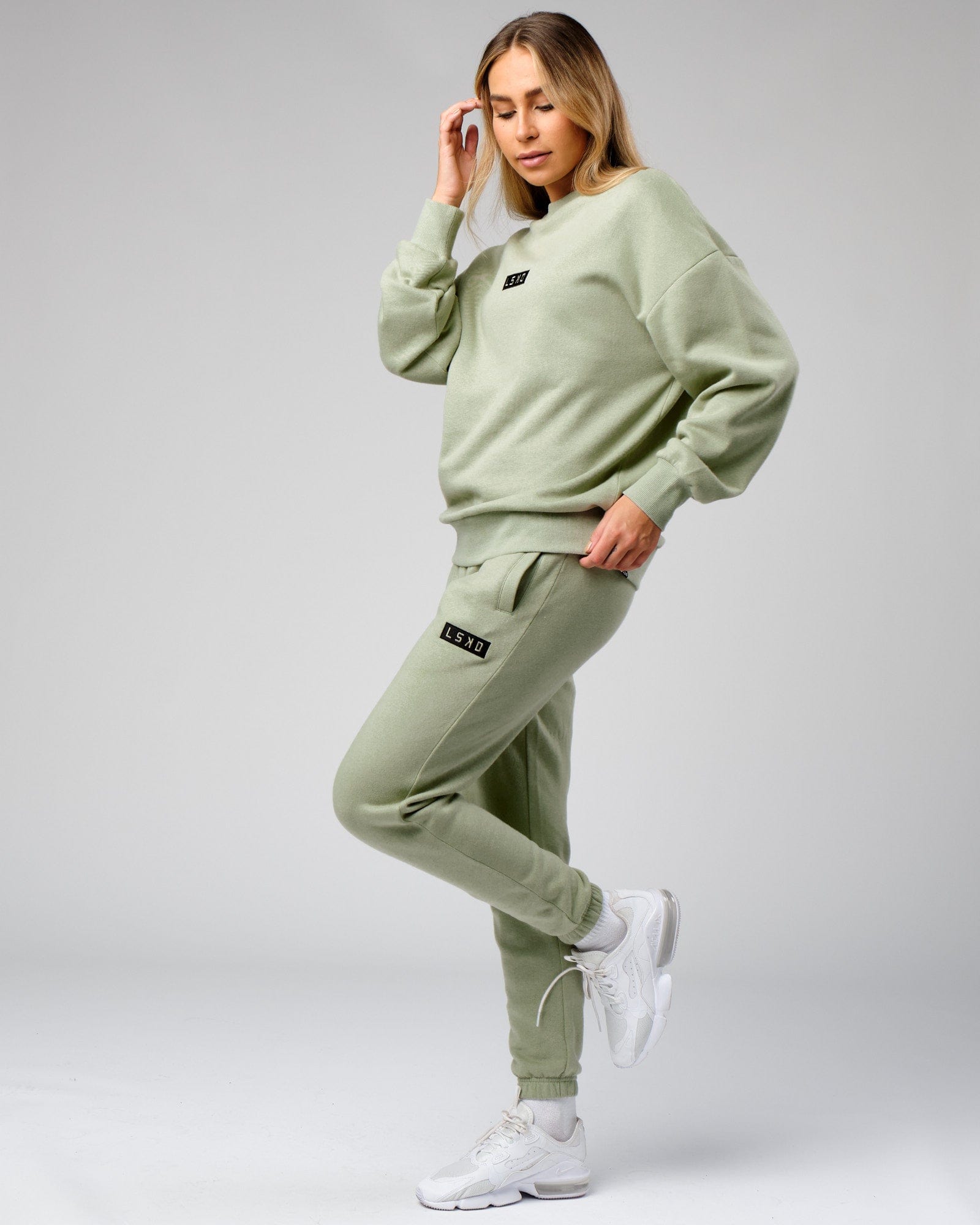Model wearing Unisex Cornerstone Track Pant Oversize - Desert Sage