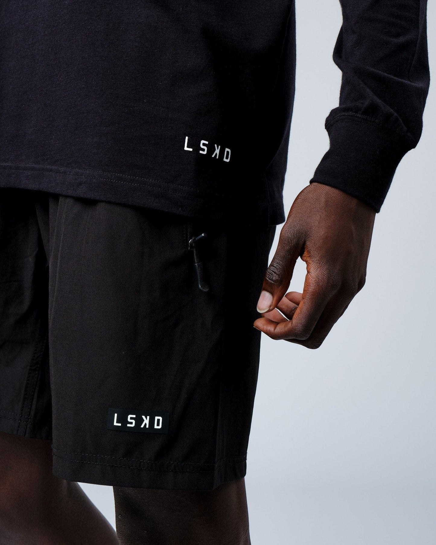 Model wearing Intensity FLXDRY Performance LS Tee - Black