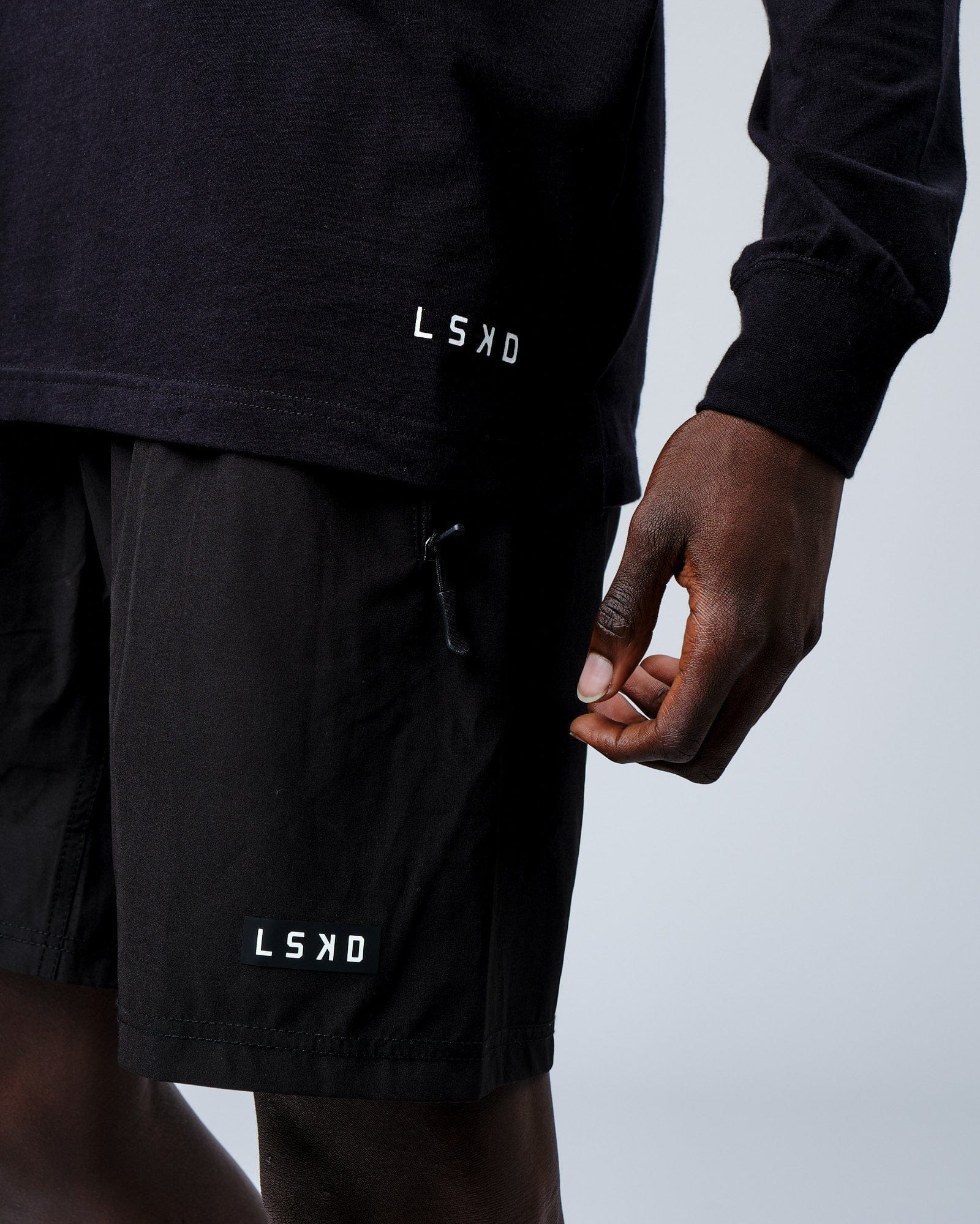 Model wearing Intensity FLXDRY Performance LS Tee - Black