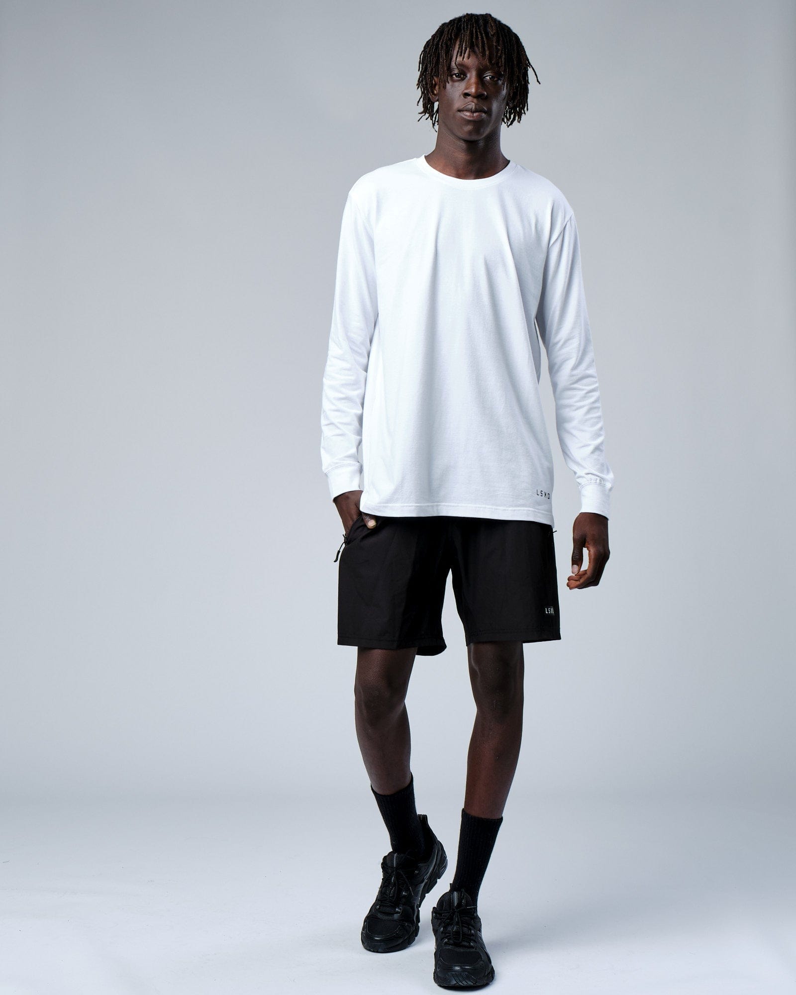 Model wearing Intensity FLXDRY Performance LS Tee - White