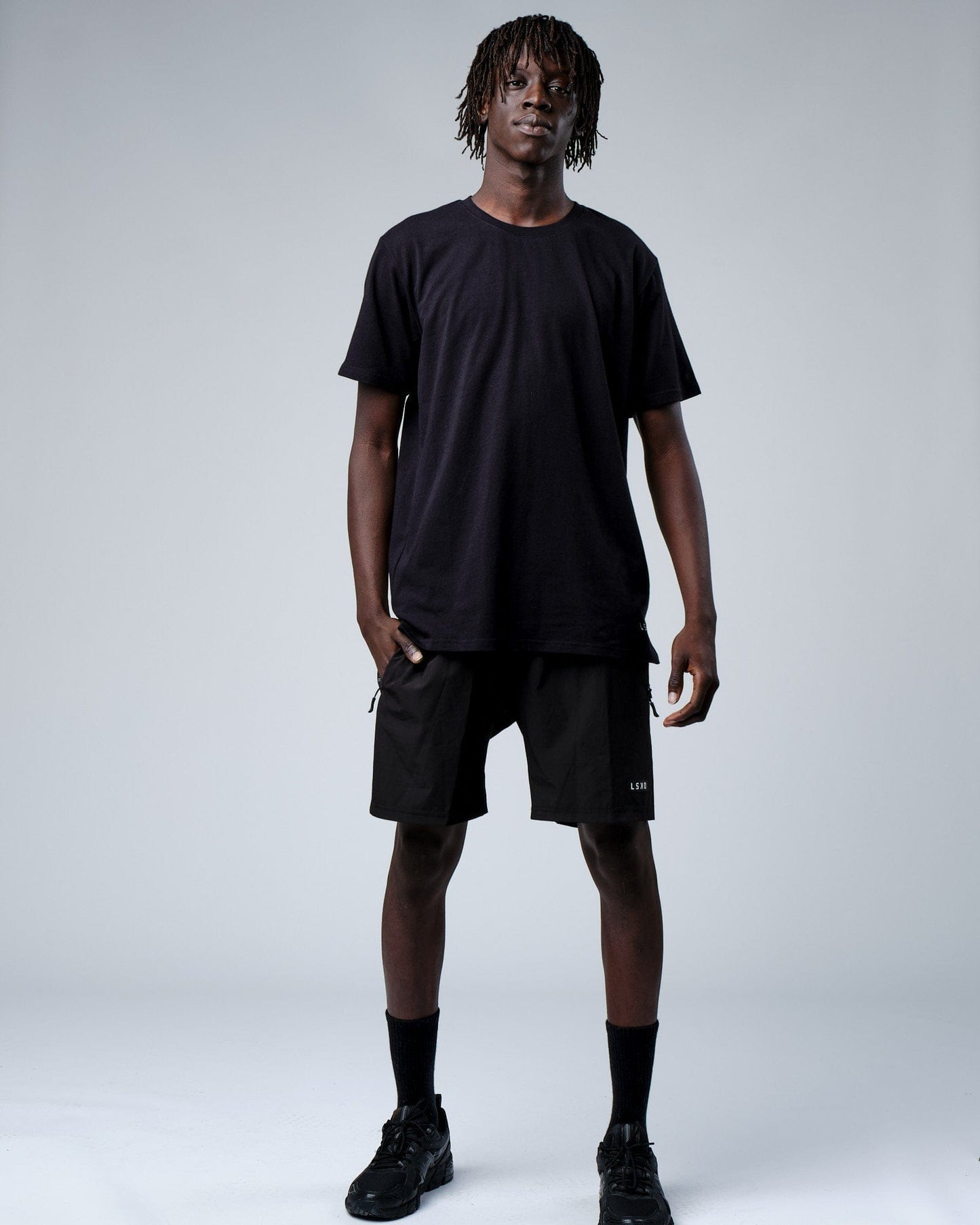 Model wearing Intensity FLXDRY Performance Tee - Black