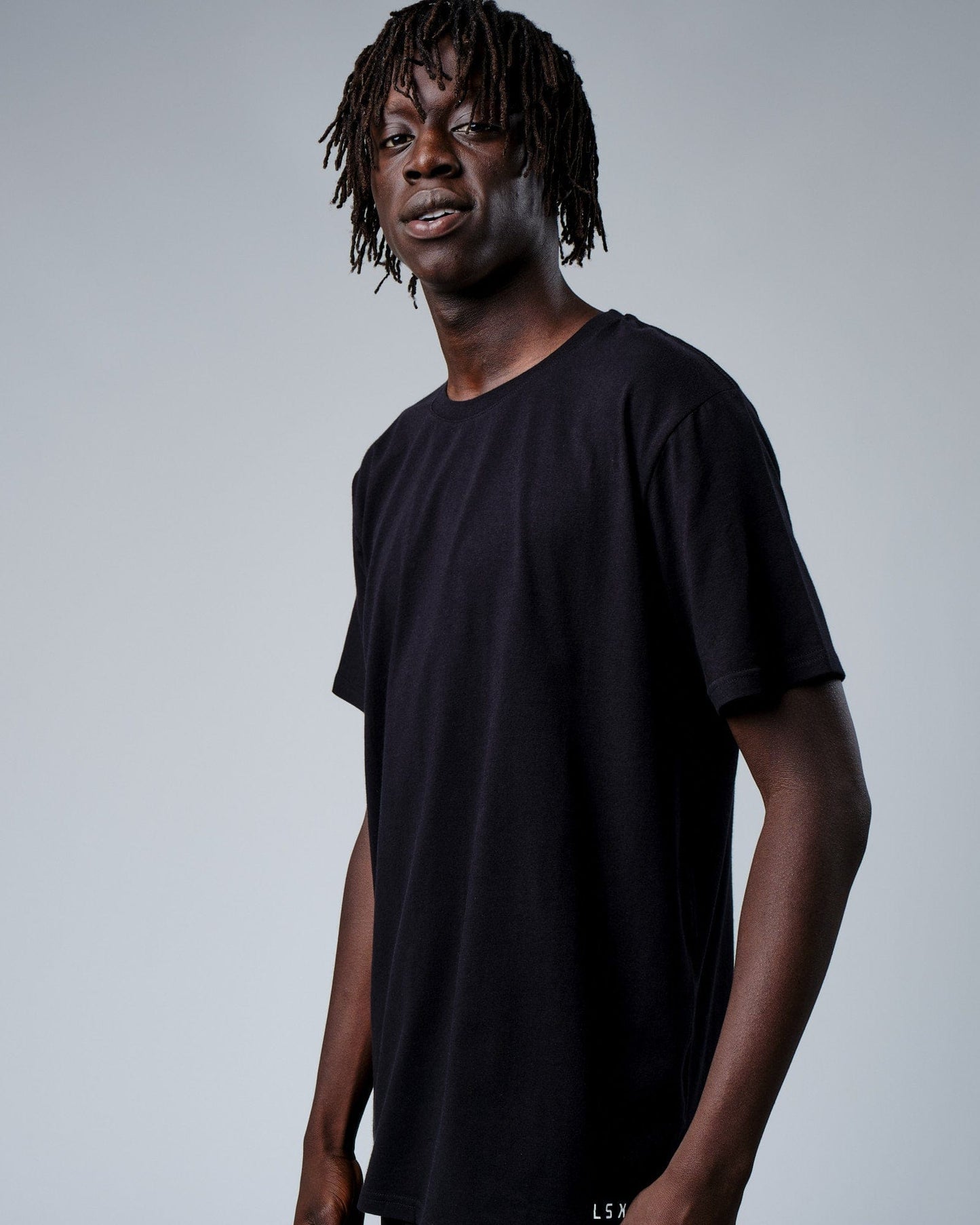 Model wearing Intensity FLXDRY Performance Tee - Black