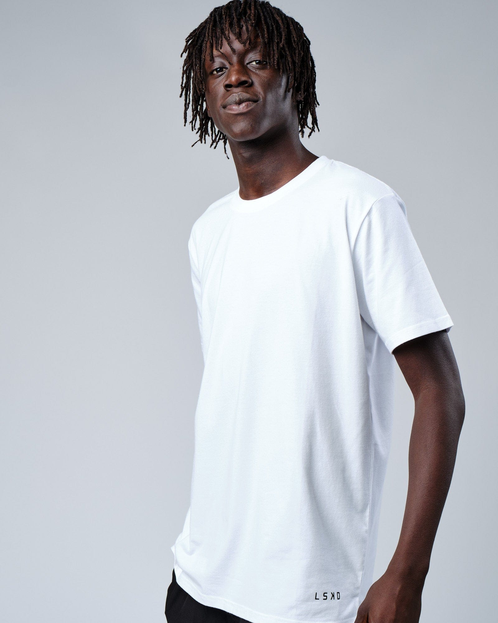 Model wearing Intensity FLXDRY Performance Tee - White