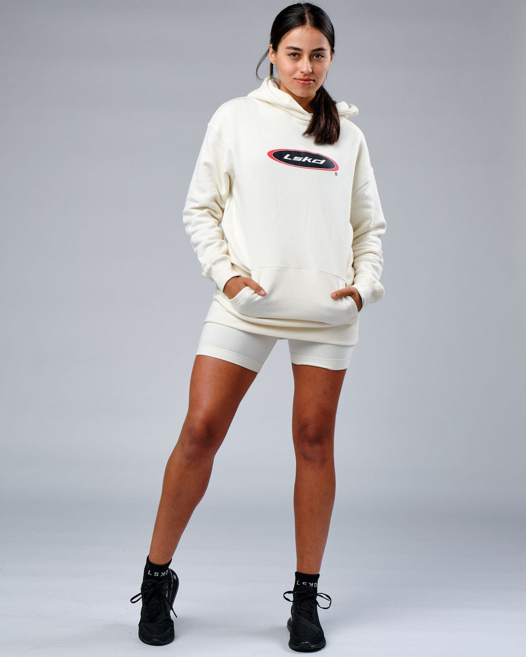 Model wearing Unisex Circa 2003 Oversize Hoodie - Cream