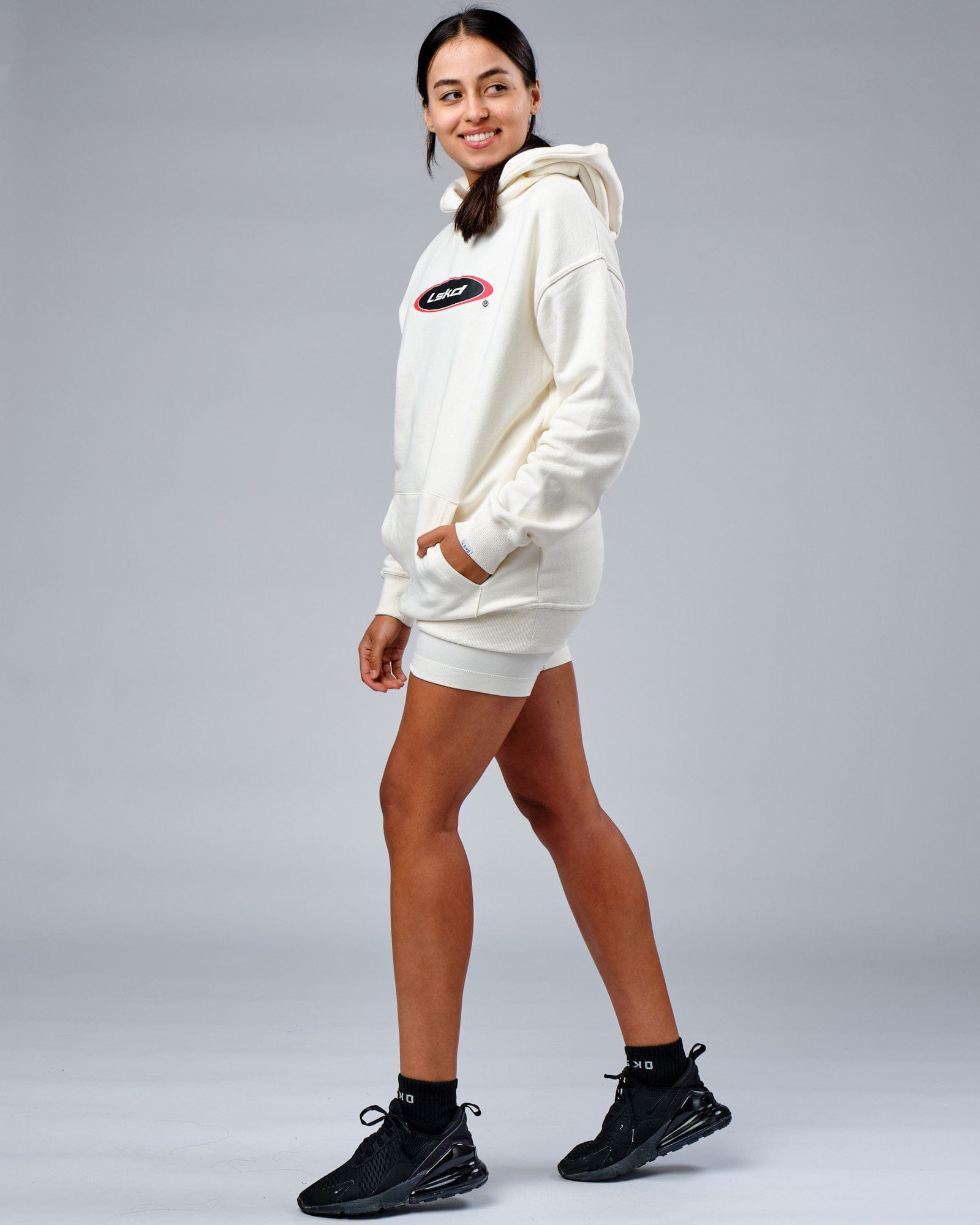 Model wearing Unisex Circa 2003 Oversize Hoodie - Cream