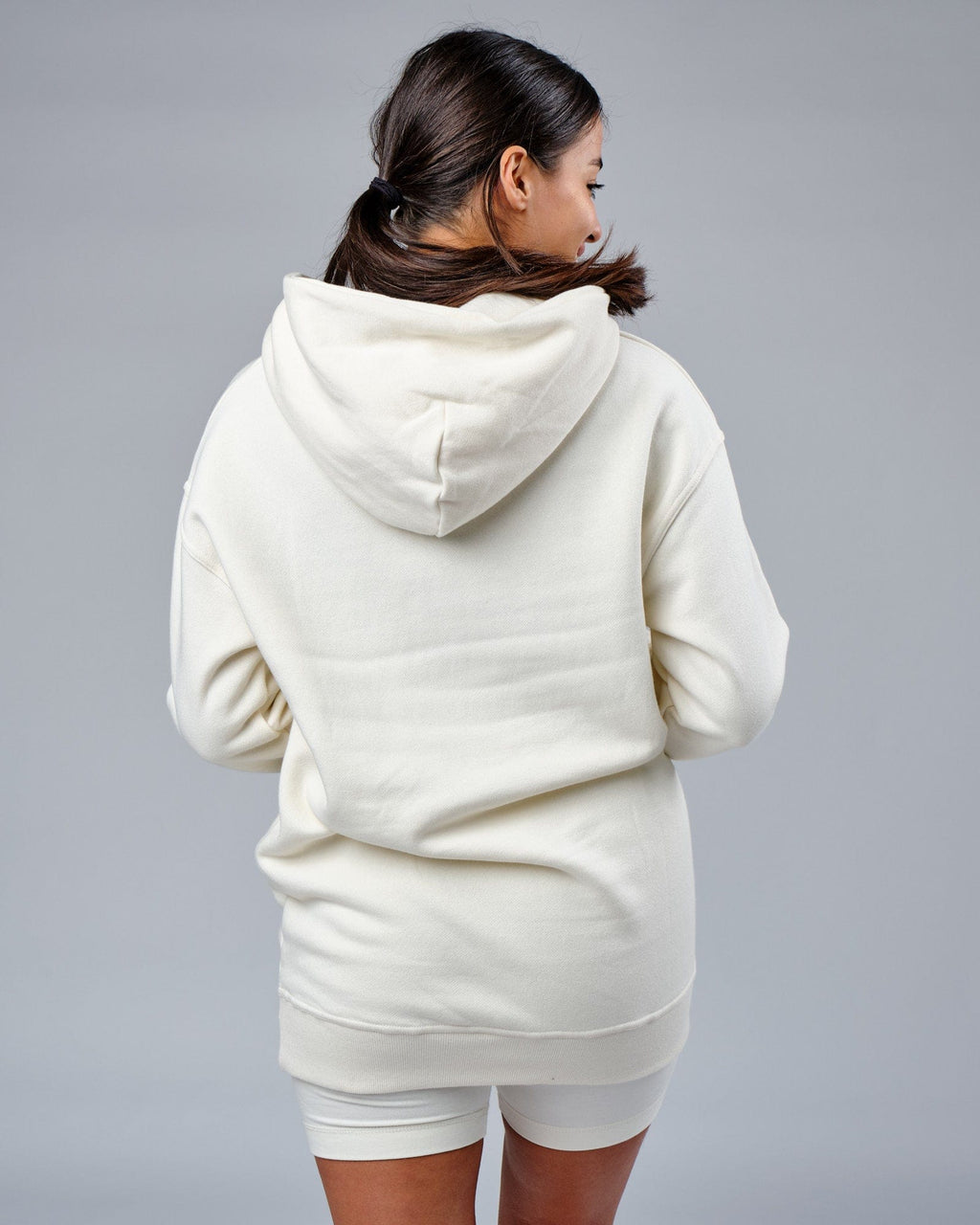 Model wearing Unisex Circa 2003 Oversize Hoodie - Cream
