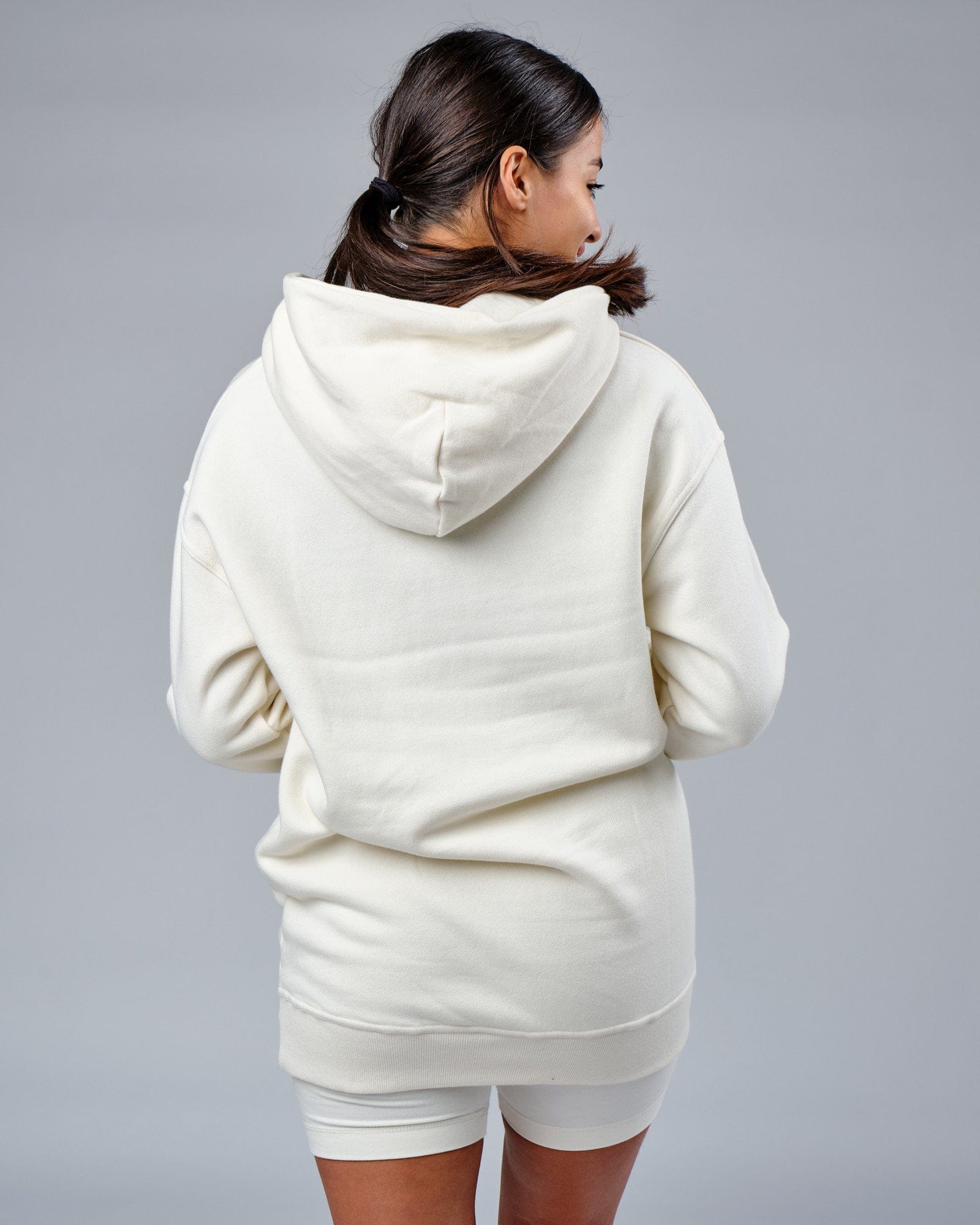 Model wearing Unisex Circa 2003 Oversize Hoodie - Cream