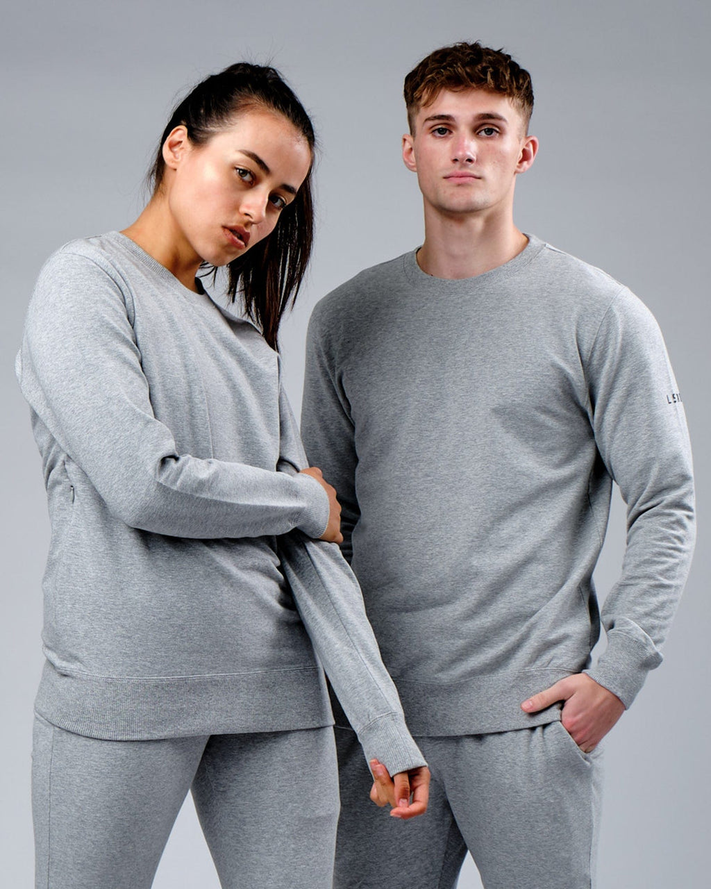 Model wearing Unisex Rival FLXFleece Training Fit Sweater - Lt Grey Marl