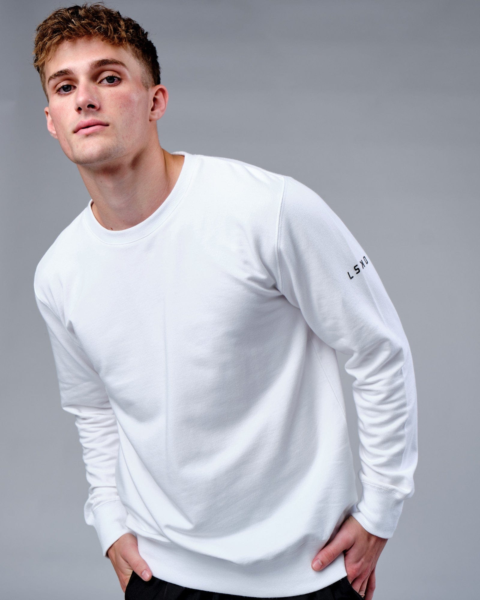 Model wearing Rival FLXFleece Training Fit Sweater - White