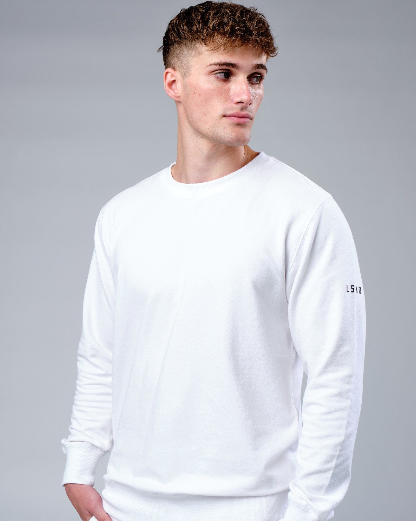 Model wearing Rival FLXFleece Training Fit Sweater - White