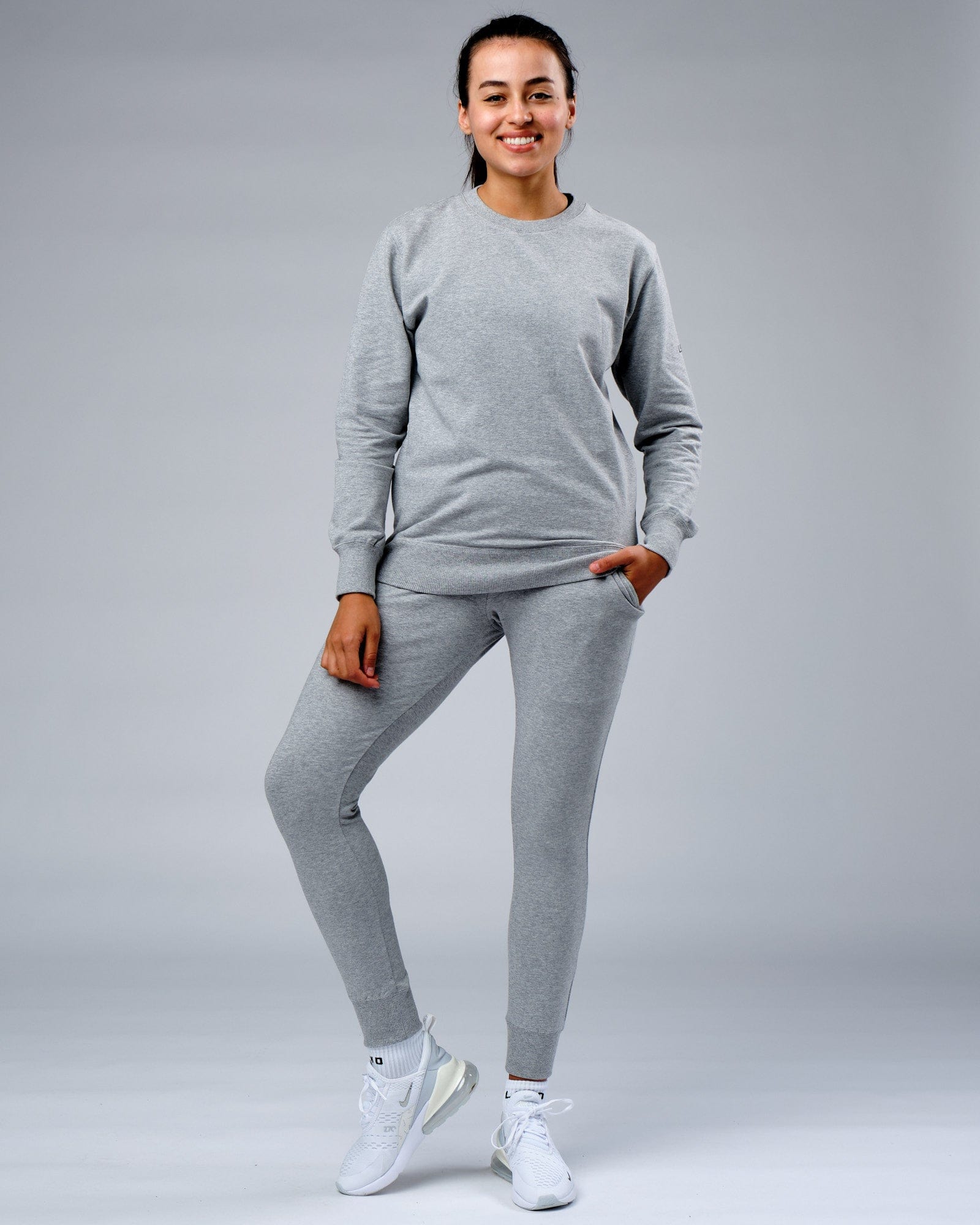Model wearing Unisex Rival FLXFleece Training Fit Sweater - Lt Grey Marl