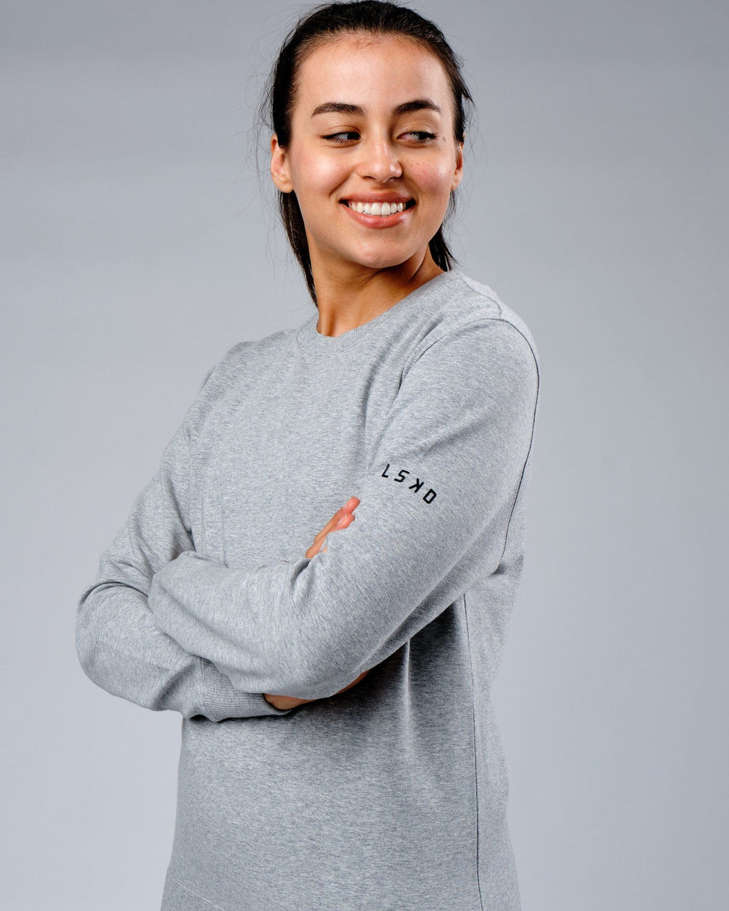Model wearing Unisex Rival FLXFleece Training Fit Sweater - Lt Grey Marl