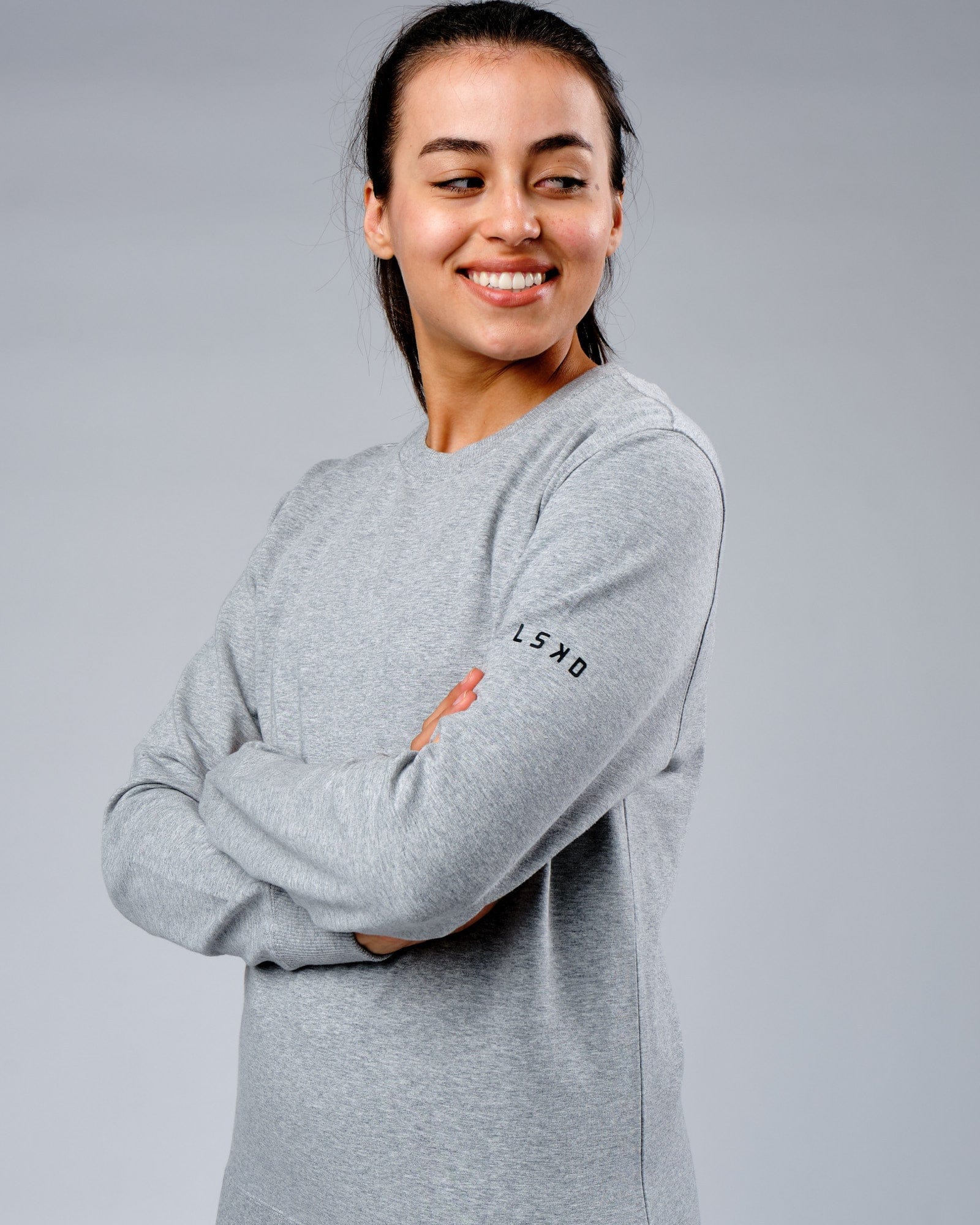 Model wearing Unisex Rival FLXFleece Training Fit Sweater - Lt Grey Marl