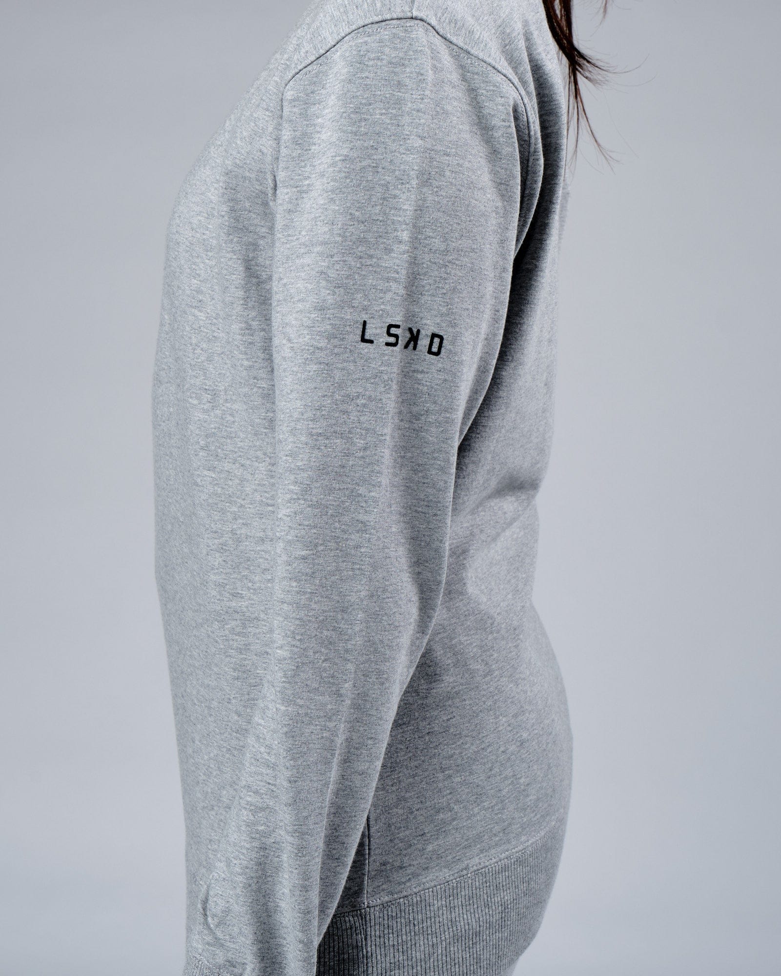 Model wearing Unisex Rival FLXFleece Training Fit Sweater - Lt Grey Marl
