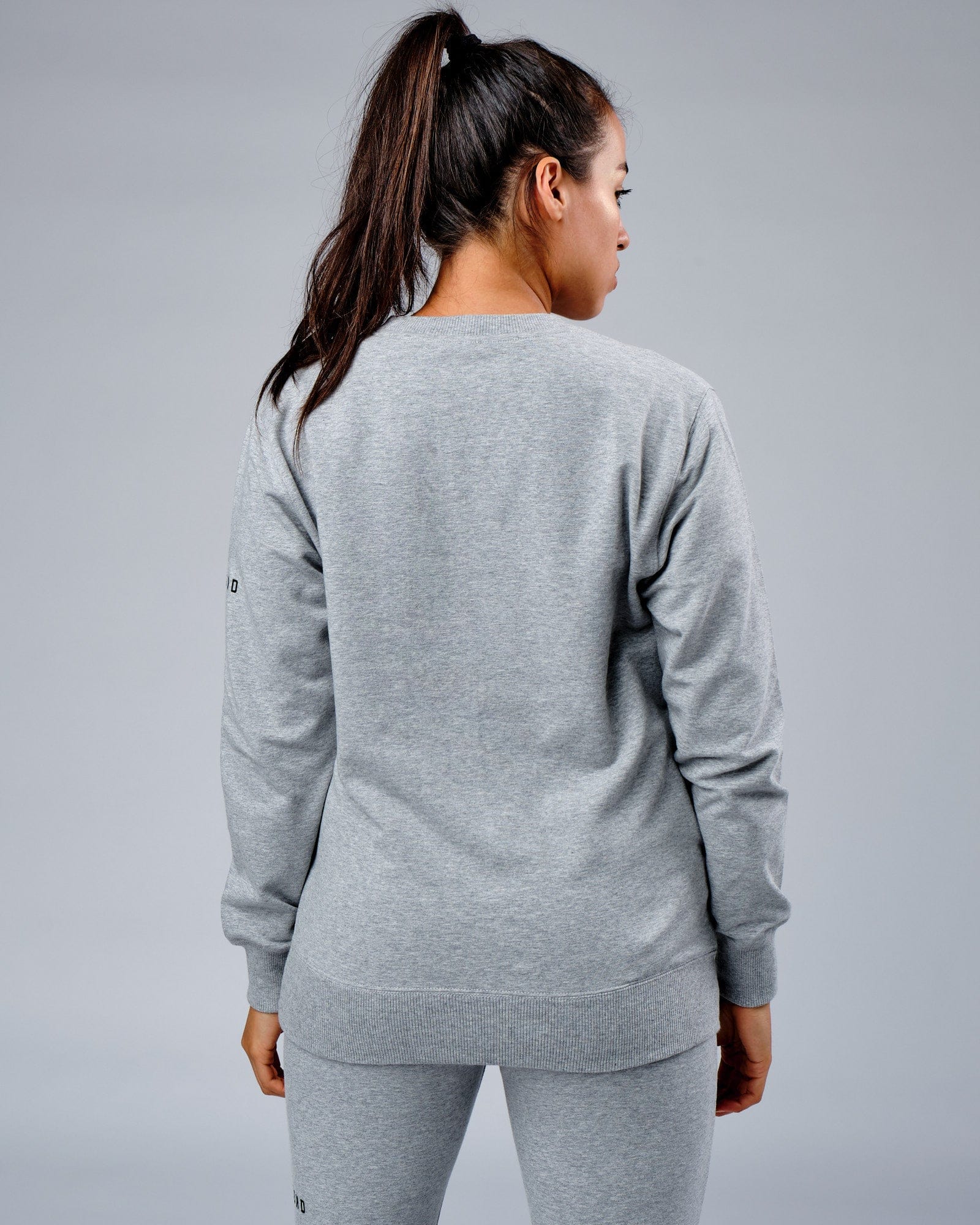 Model wearing Unisex Rival FLXFleece Training Fit Sweater - Lt Grey Marl