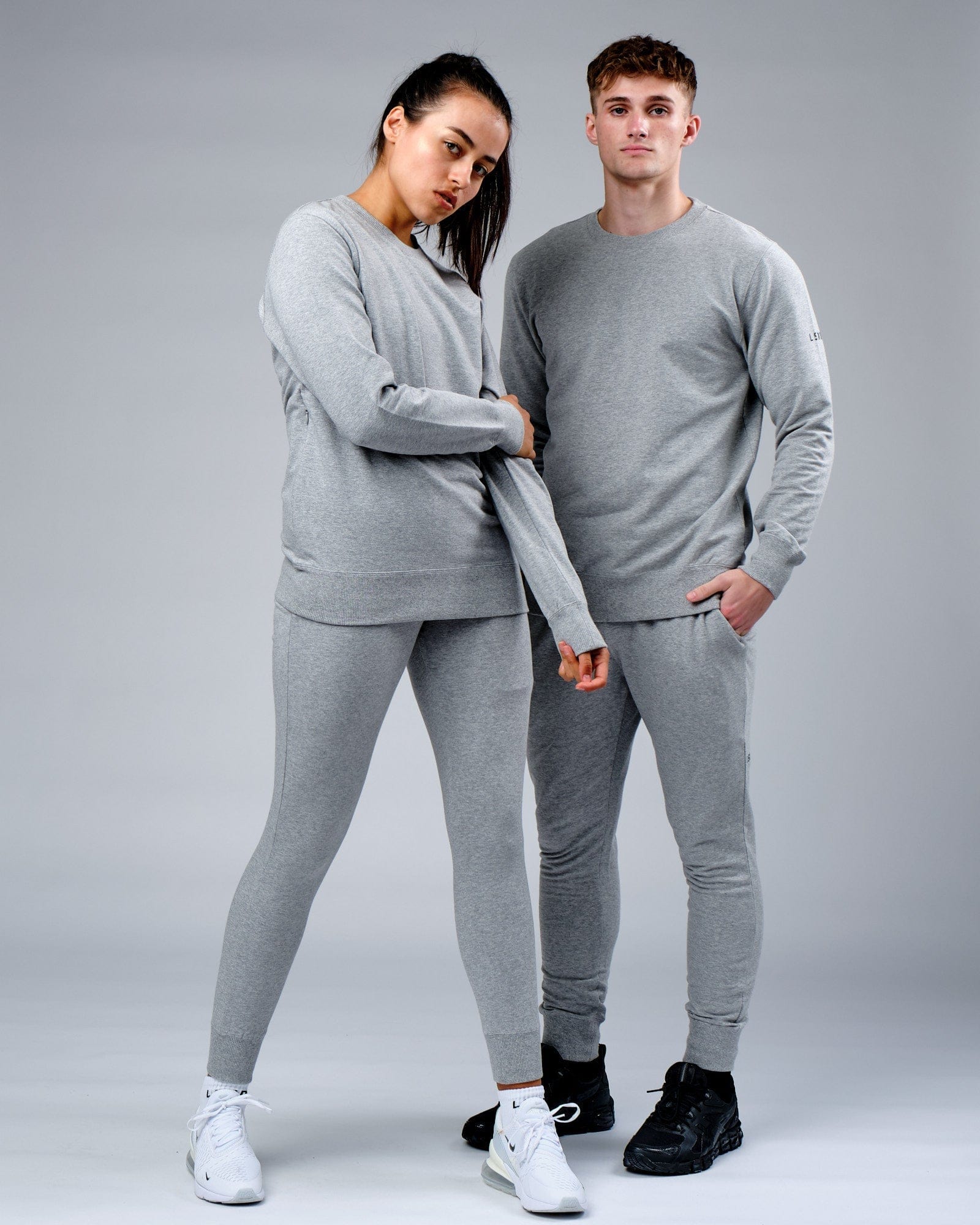 Model wearing Unisex Rival FLXFleece Track Pant - Lt Grey Marl