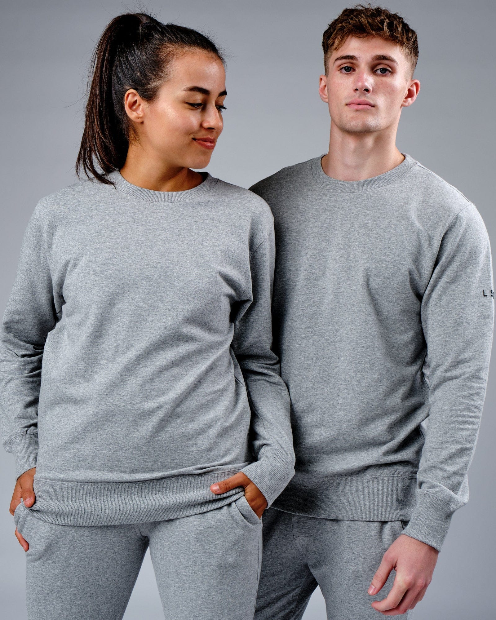 Model wearing Unisex Rival FLXFleece Training Fit Sweater - Lt Grey Marl