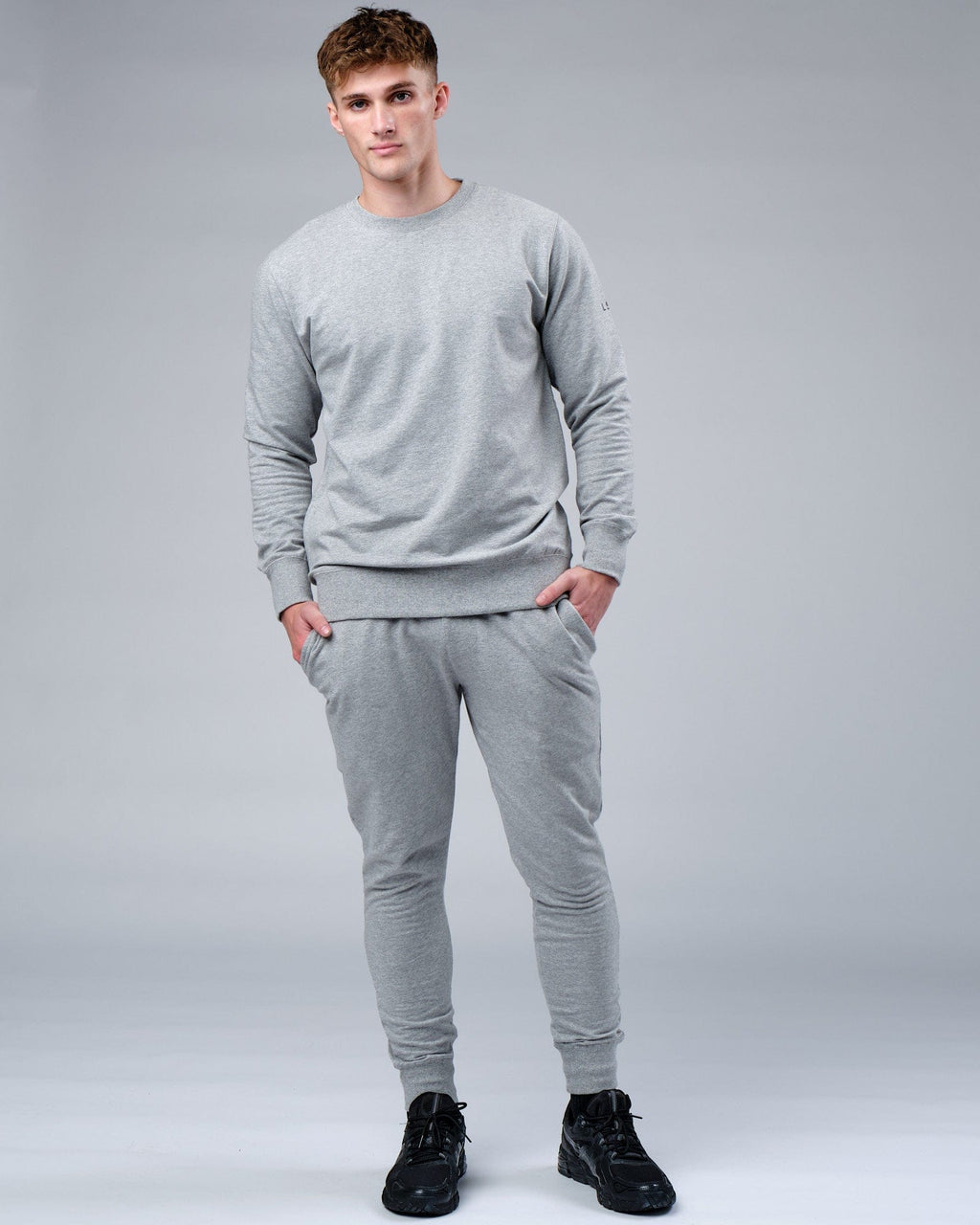 Model wearing Rival FLXFleece Track Pant - Lt Grey Marl