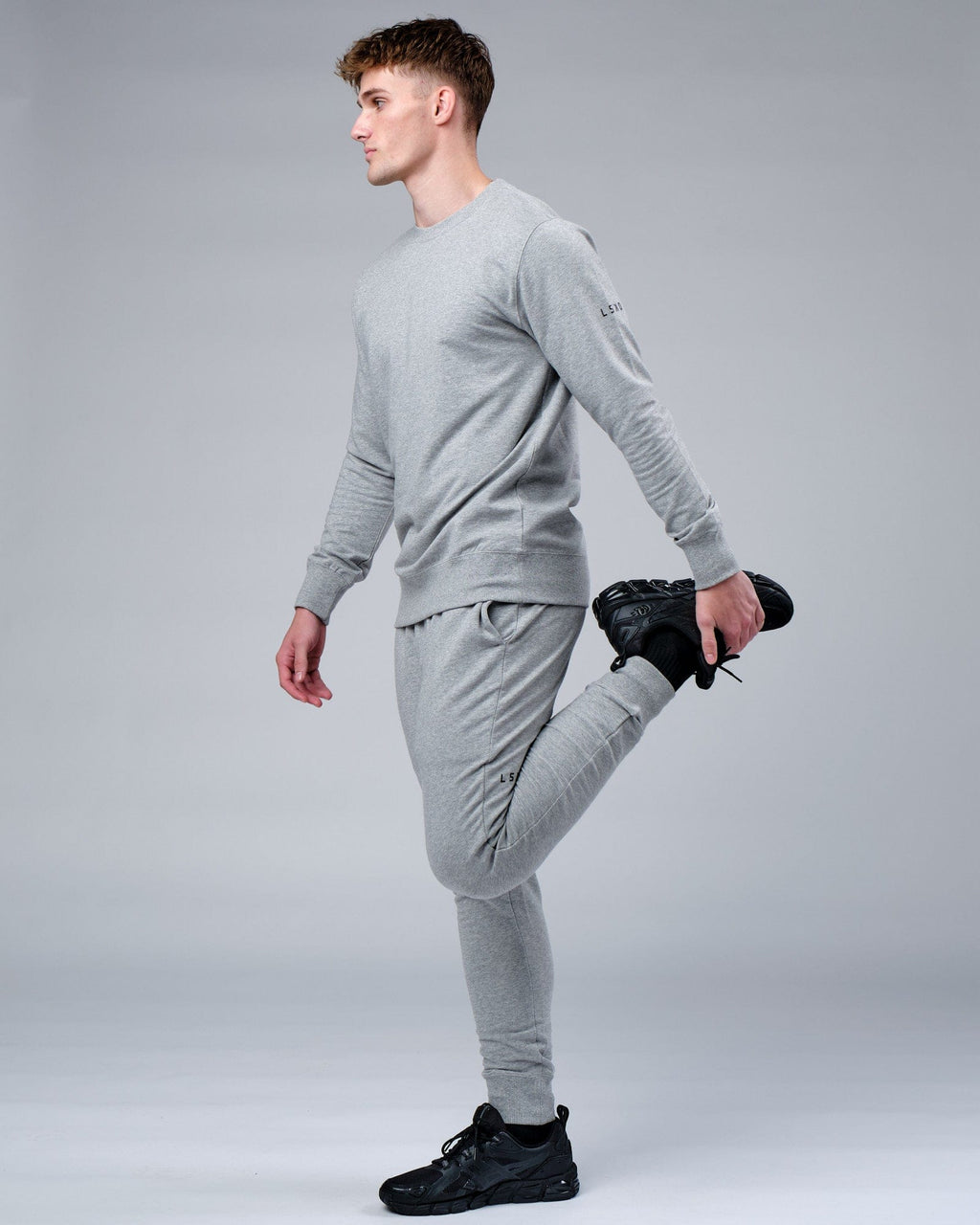 Model wearing Rival FLXFleece Track Pant - Lt Grey Marl
