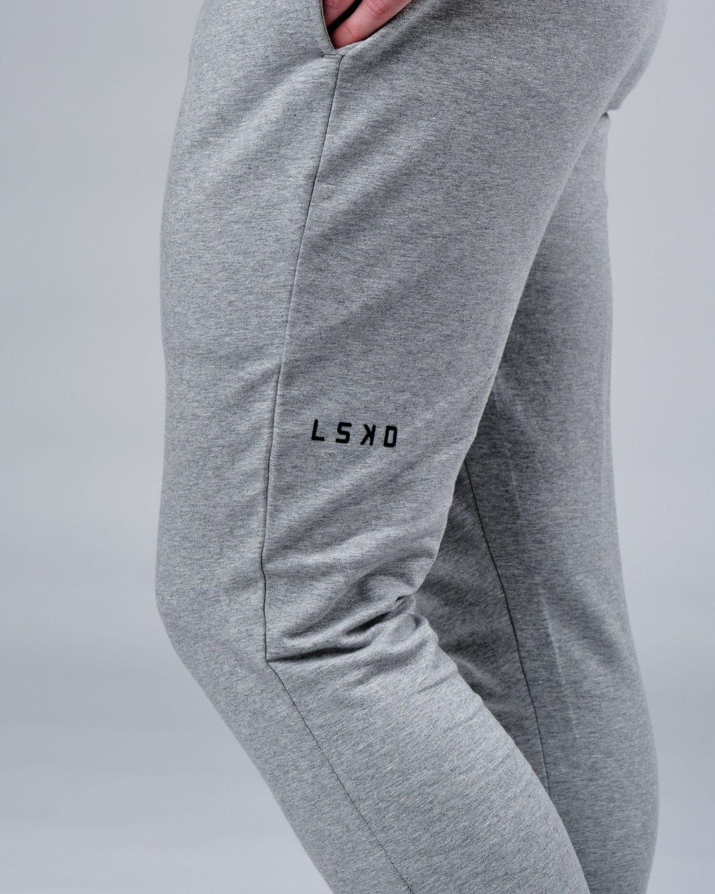 Model wearing Rival FLXFleece Track Pant - Lt Grey Marl