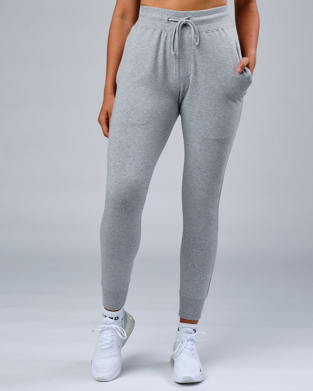 Model wearing Unisex Rival FLXFleece Track Pant - Lt Grey Marl