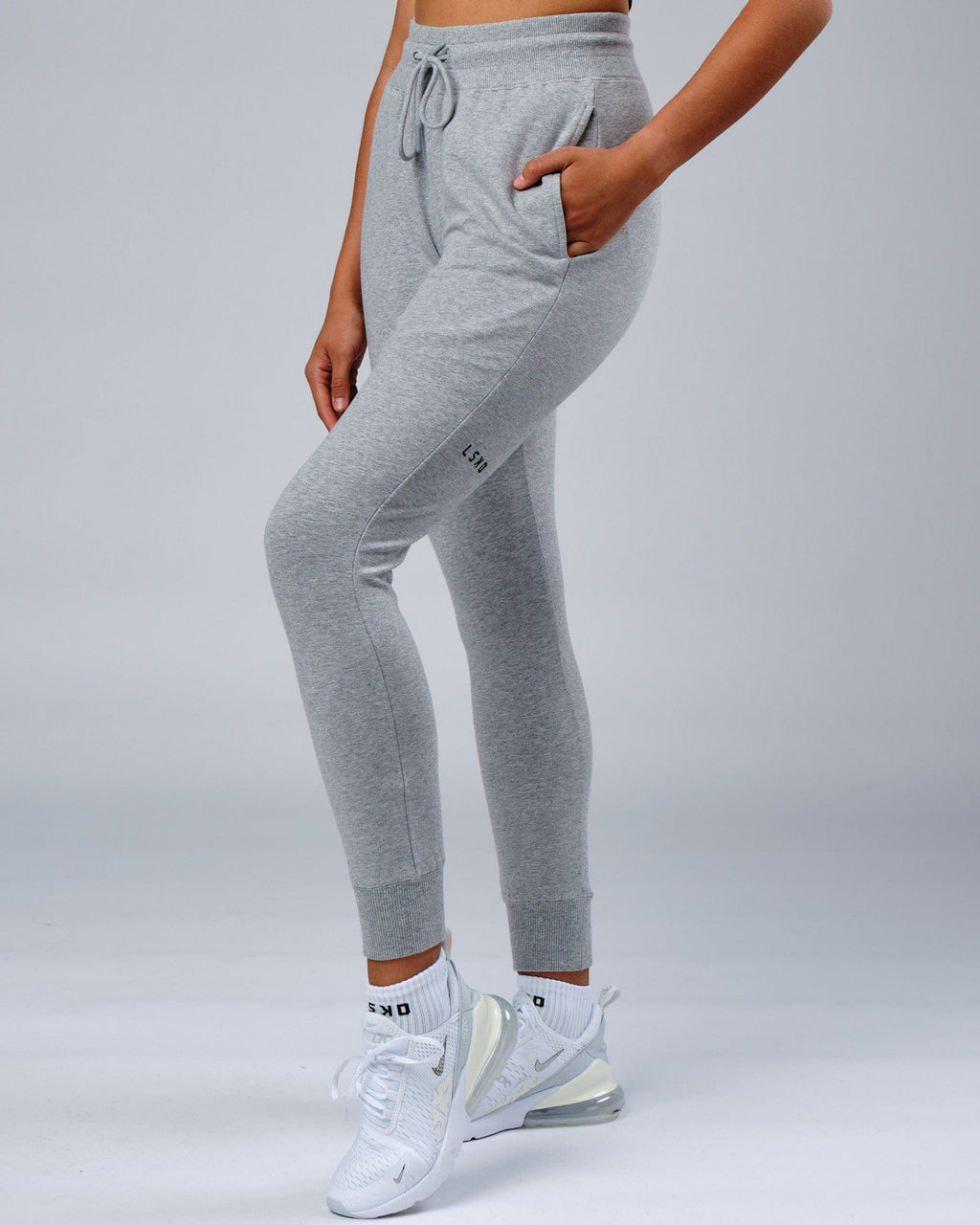 Model wearing Unisex Rival FLXFleece Track Pant - Lt Grey Marl