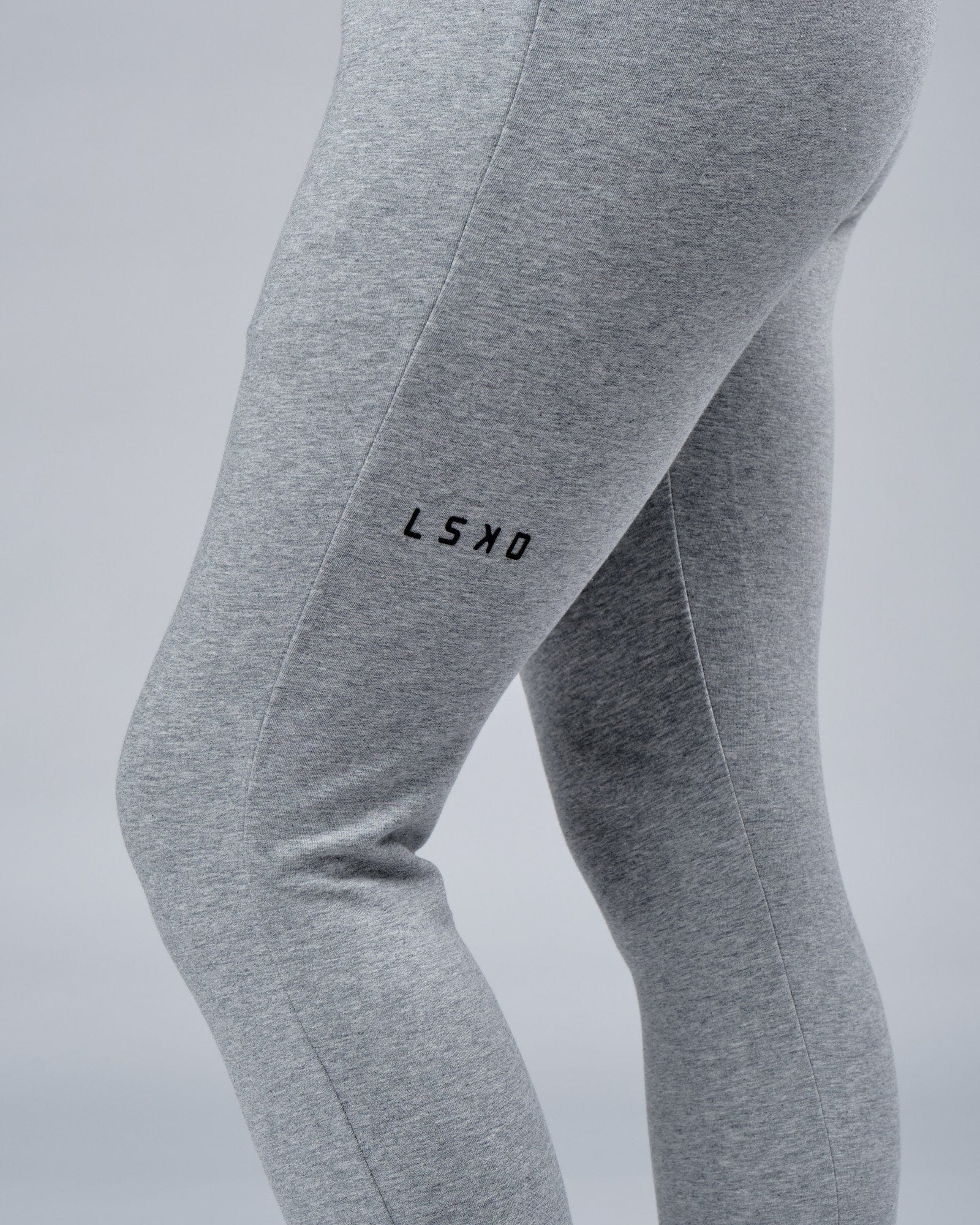 Model wearing Unisex Rival FLXFleece Track Pant - Lt Grey Marl