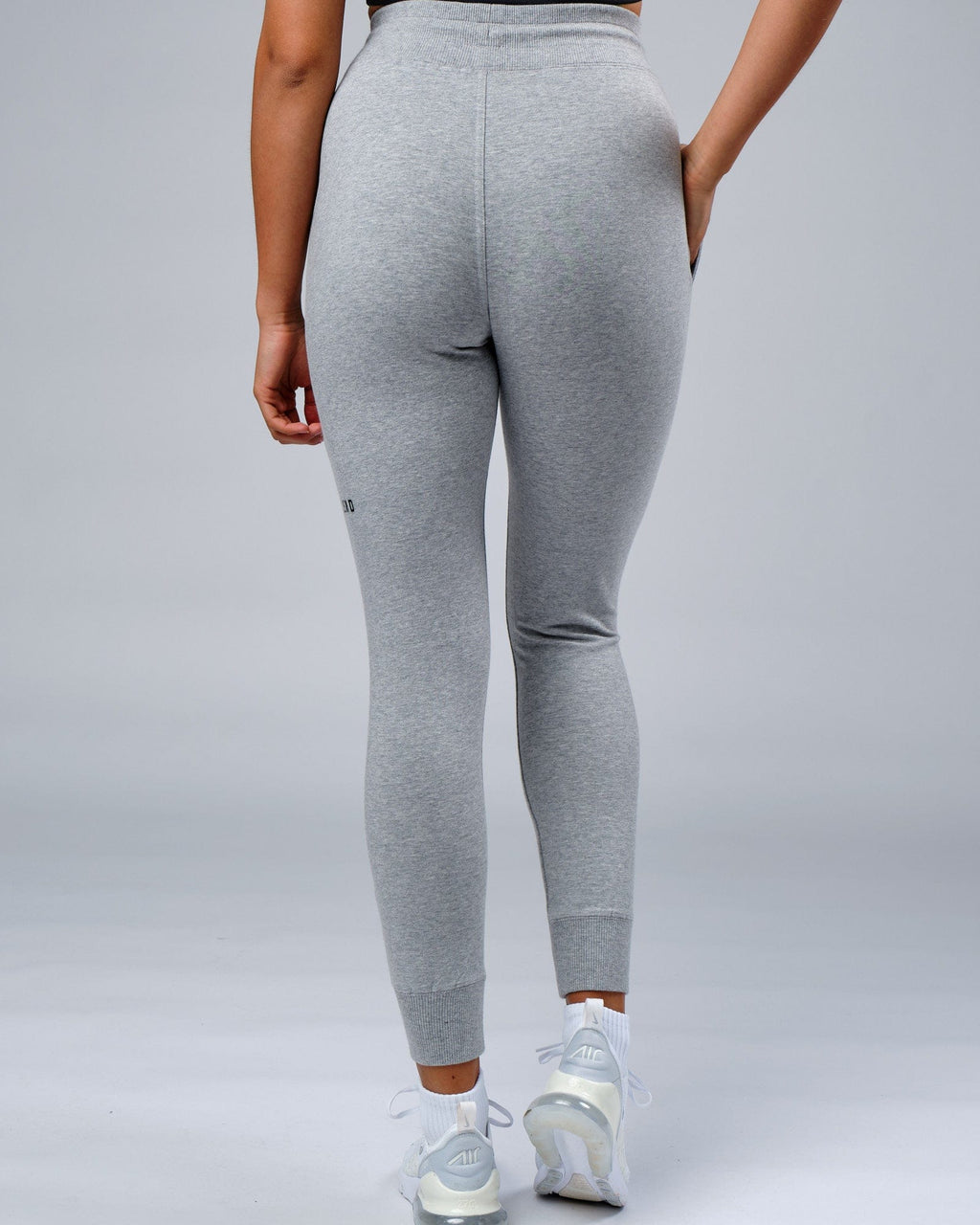 Model wearing Unisex Rival FLXFleece Track Pant - Lt Grey Marl