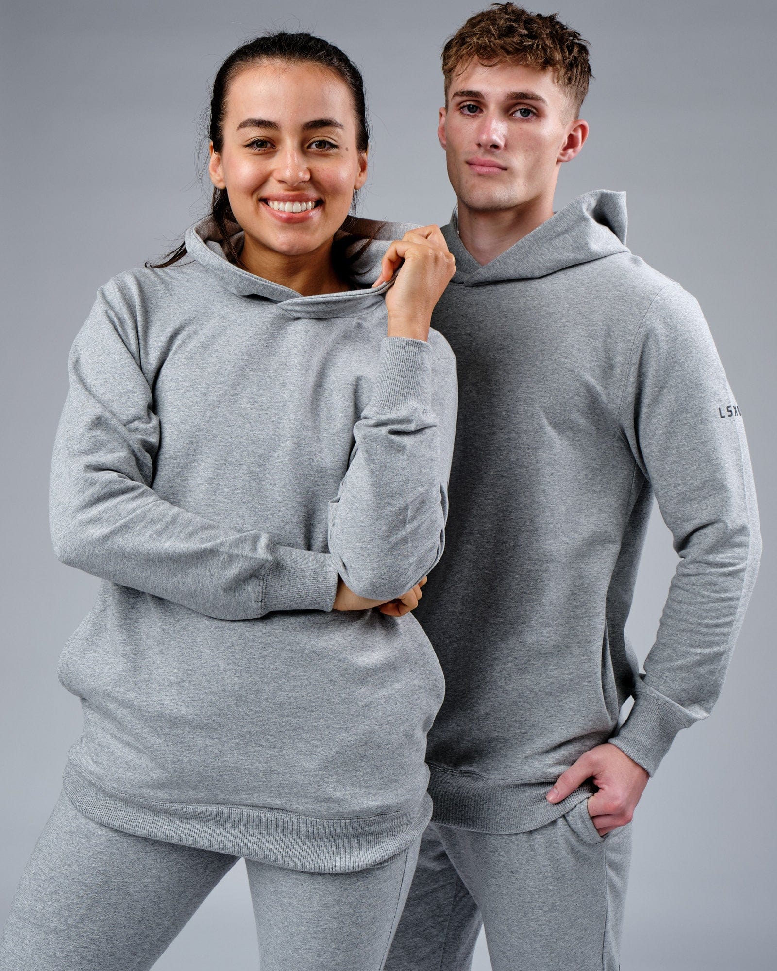 Model wearing Unisex Rival FLXFleece Training Fit Hoodie - Lt Grey Marl