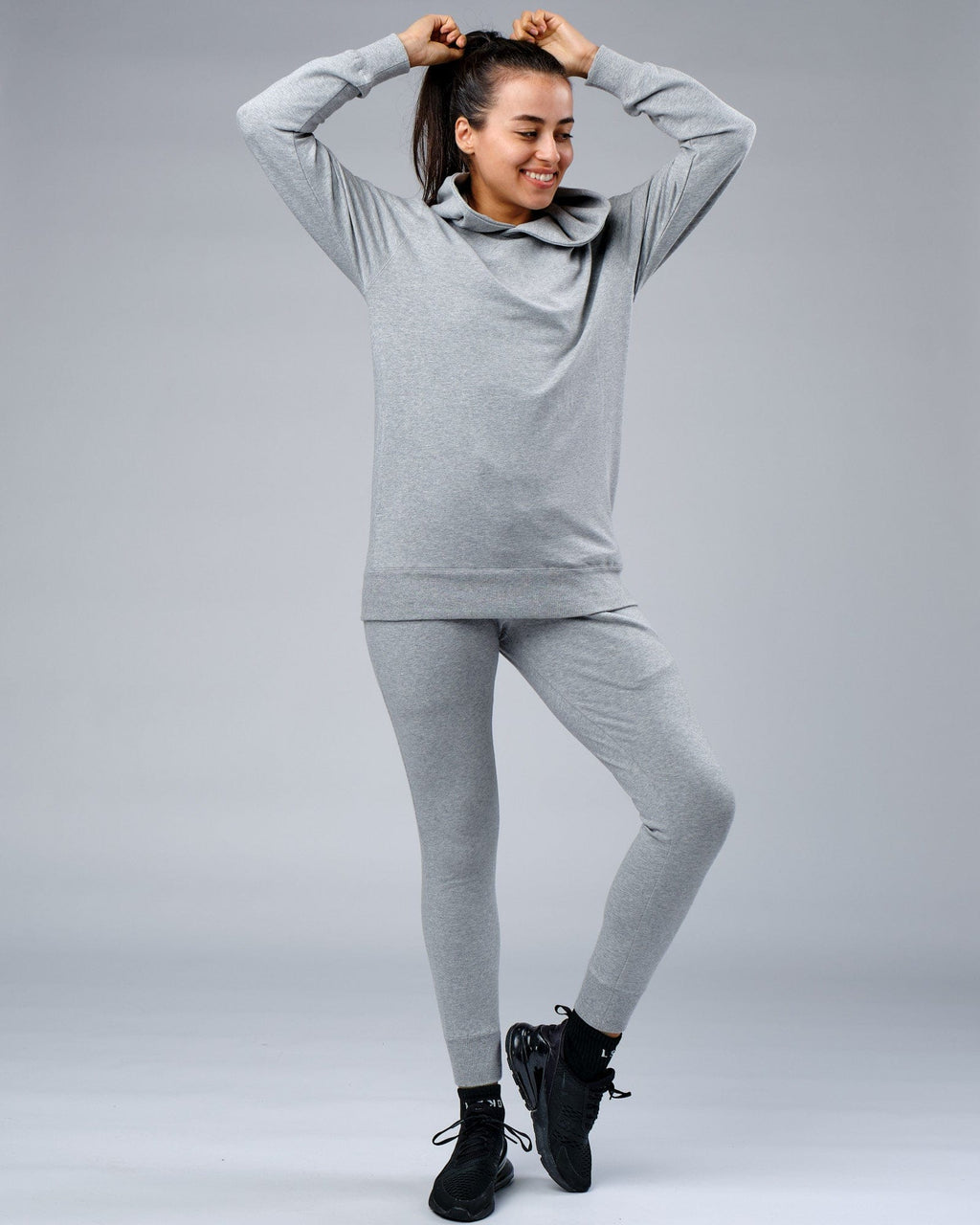 Model wearing Unisex Rival FLXFleece Training Fit Hoodie - Lt Grey Marl