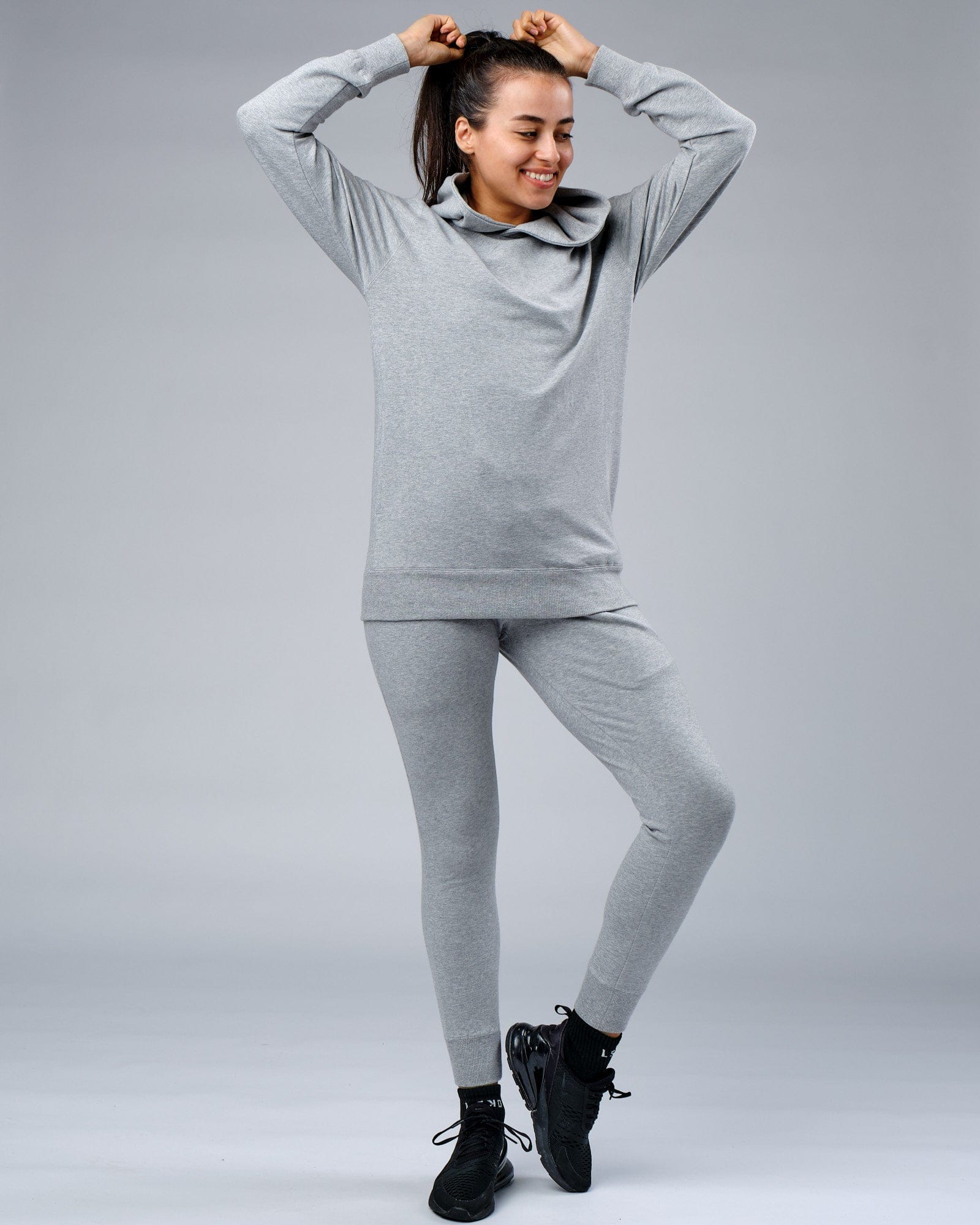 Model wearing Unisex Rival FLXFleece Training Fit Hoodie - Lt Grey Marl