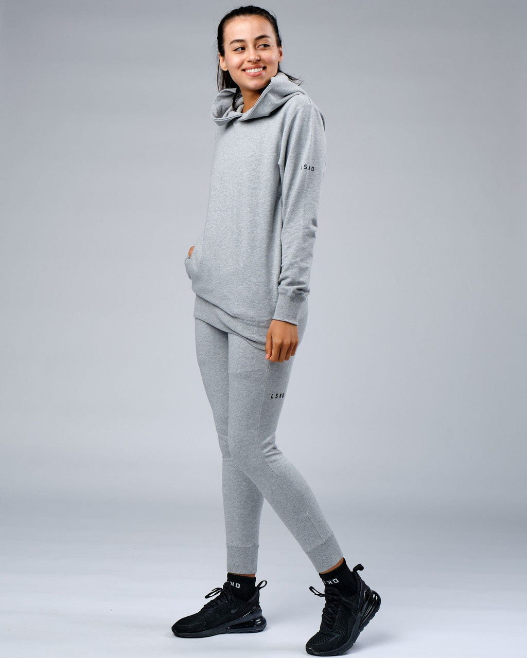 Model wearing Unisex Rival FLXFleece Training Fit Hoodie - Lt Grey Marl