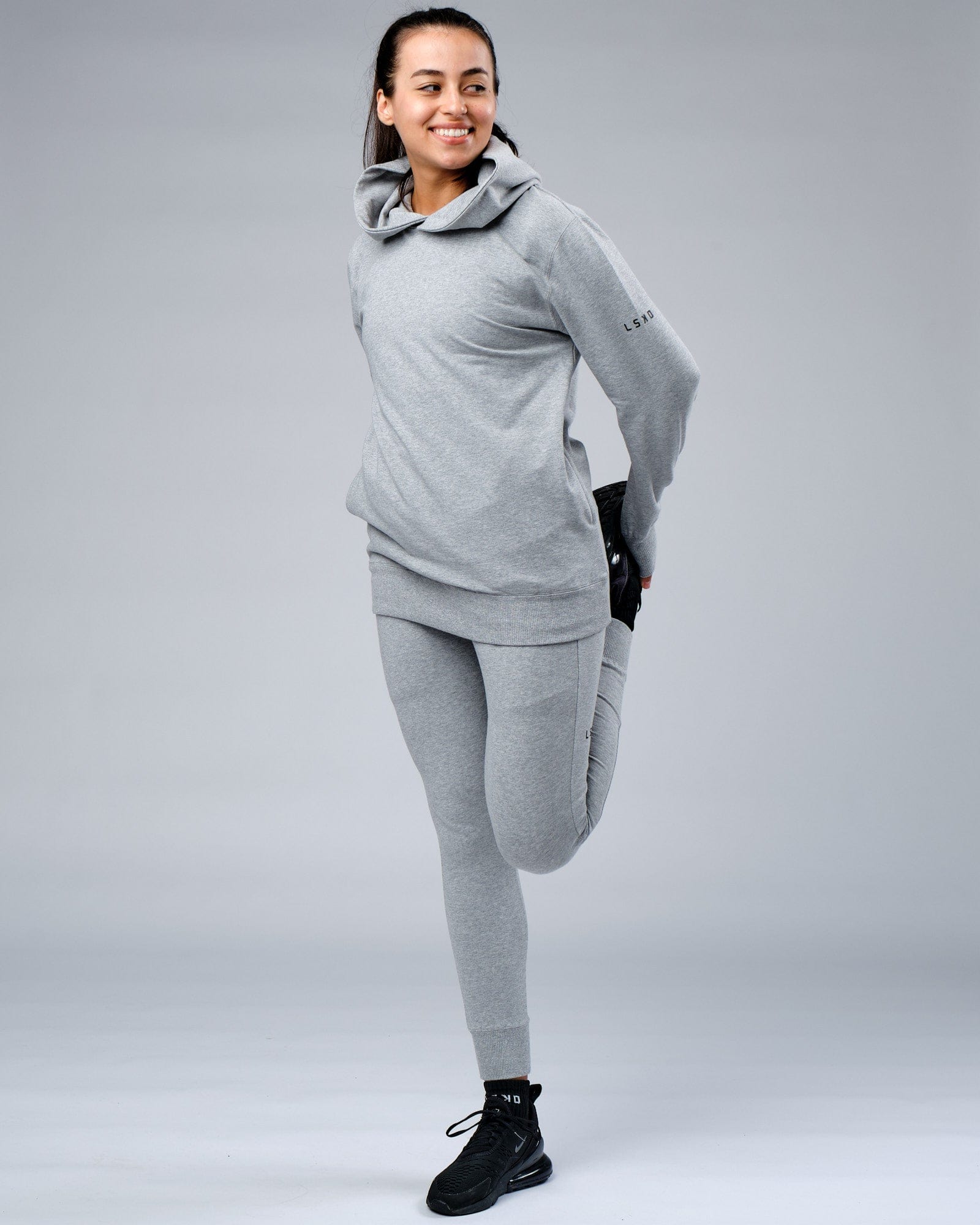 Model wearing Unisex Rival FLXFleece Training Fit Hoodie - Lt Grey Marl