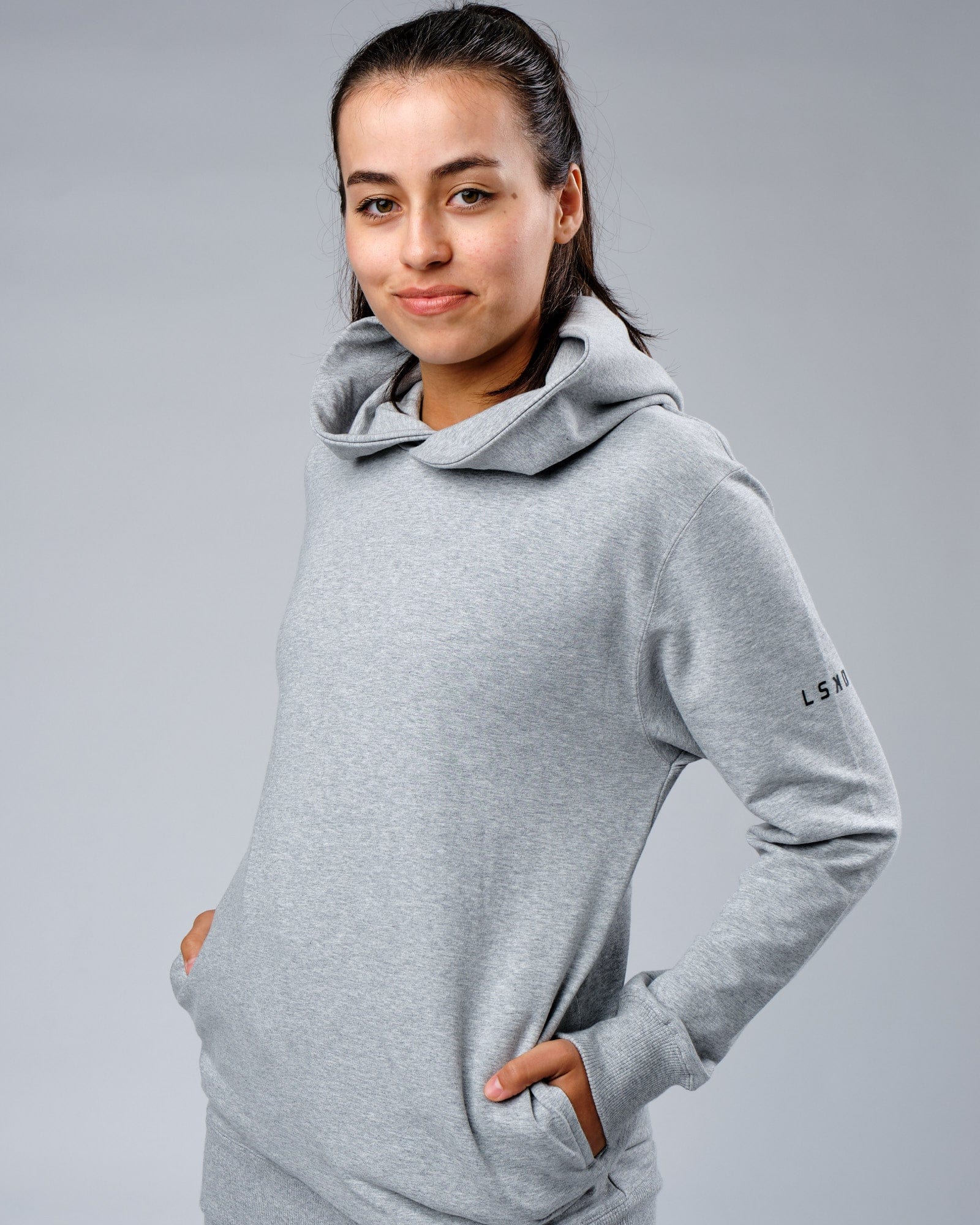 Model wearing Unisex Rival FLXFleece Training Fit Hoodie - Lt Grey Marl