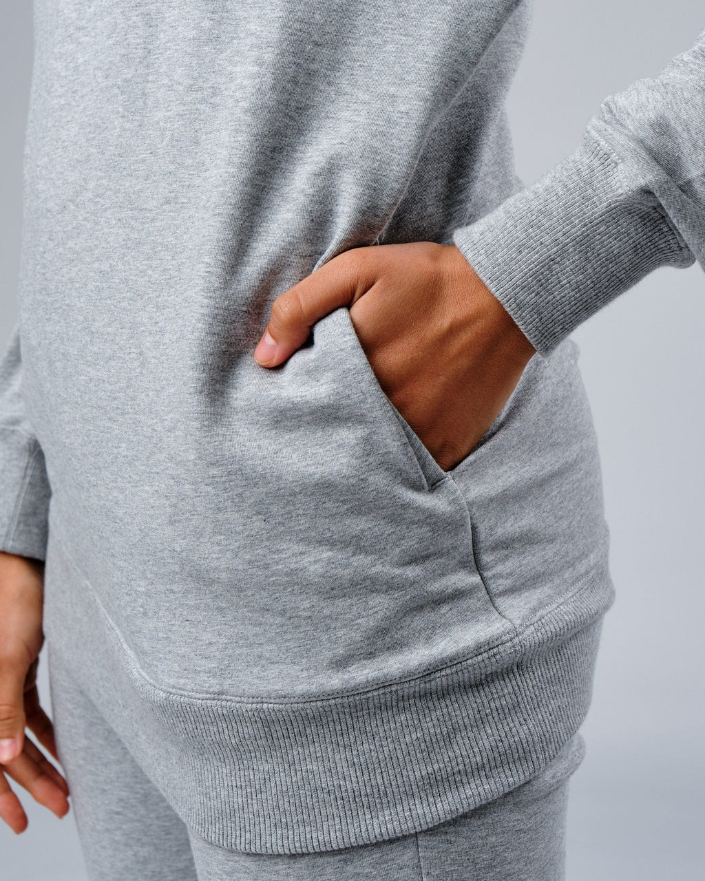 Model wearing Unisex Rival FLXFleece Training Fit Hoodie - Lt Grey Marl