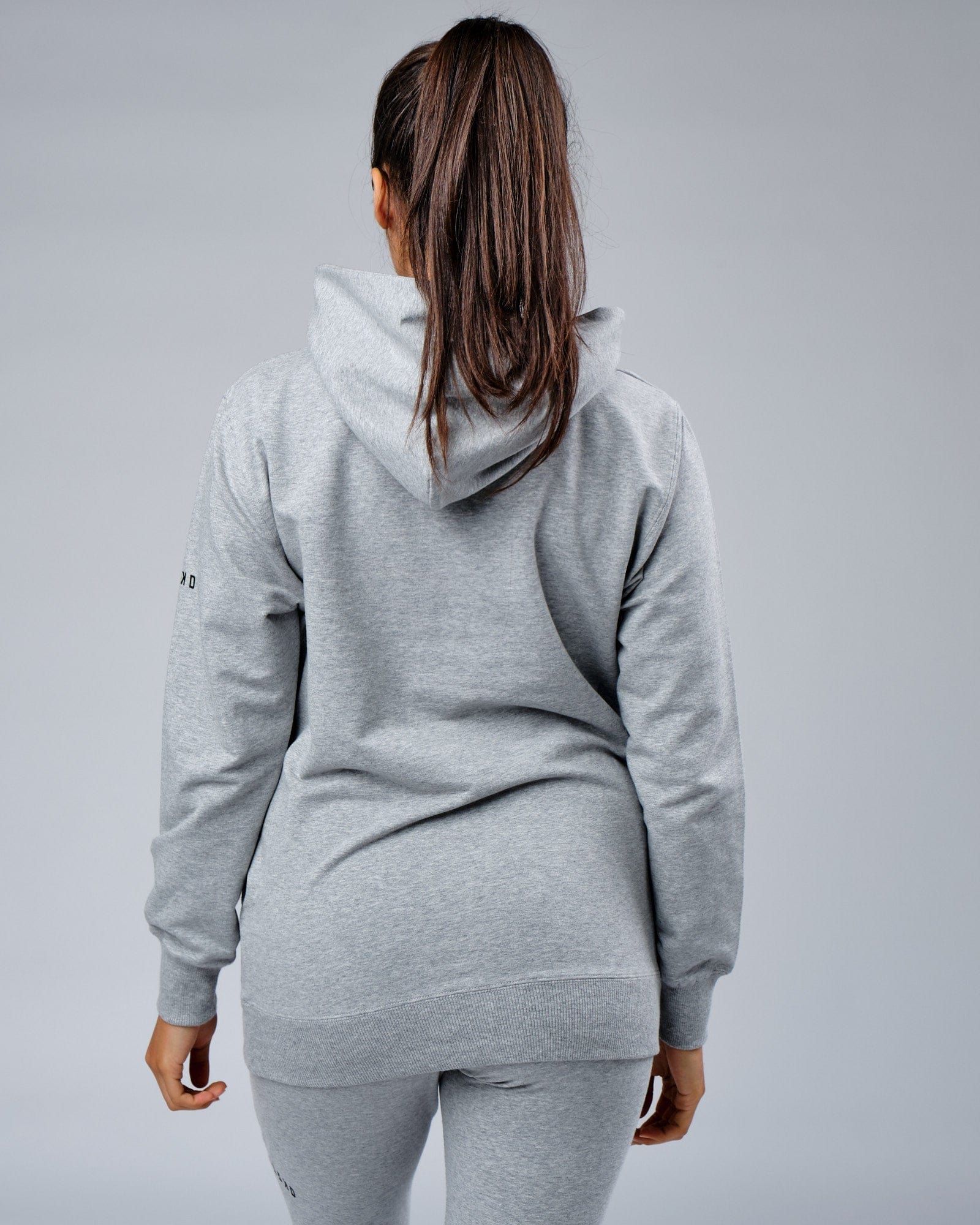 Model wearing Unisex Rival FLXFleece Training Fit Hoodie - Lt Grey Marl