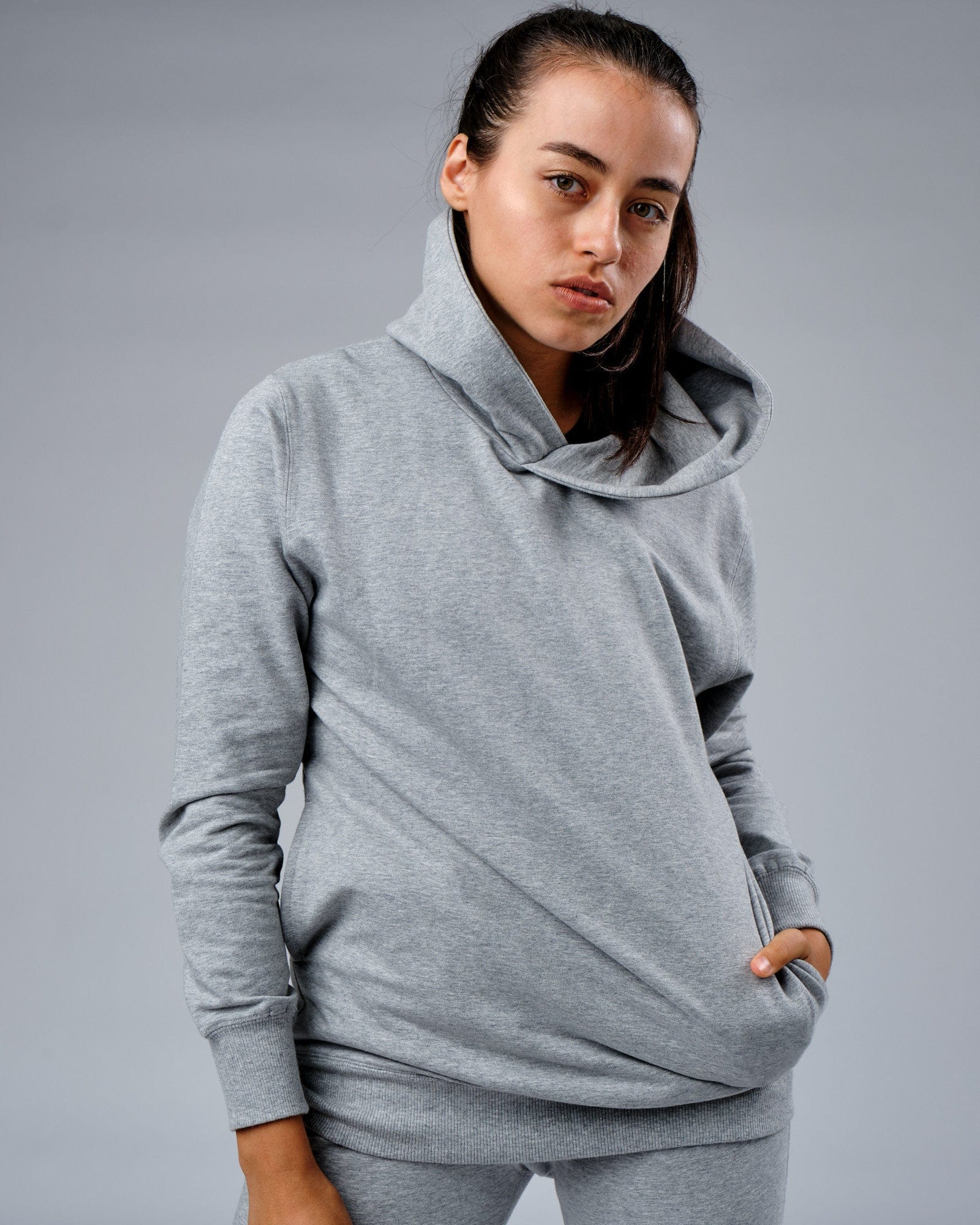 Model wearing Unisex Rival FLXFleece Training Fit Hoodie - Lt Grey Marl