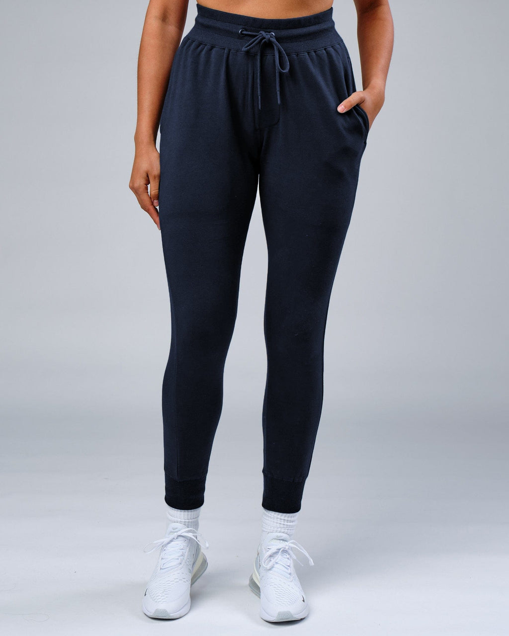 Model wearing Unisex Rival FLXFleece Track Pant - Carbon
