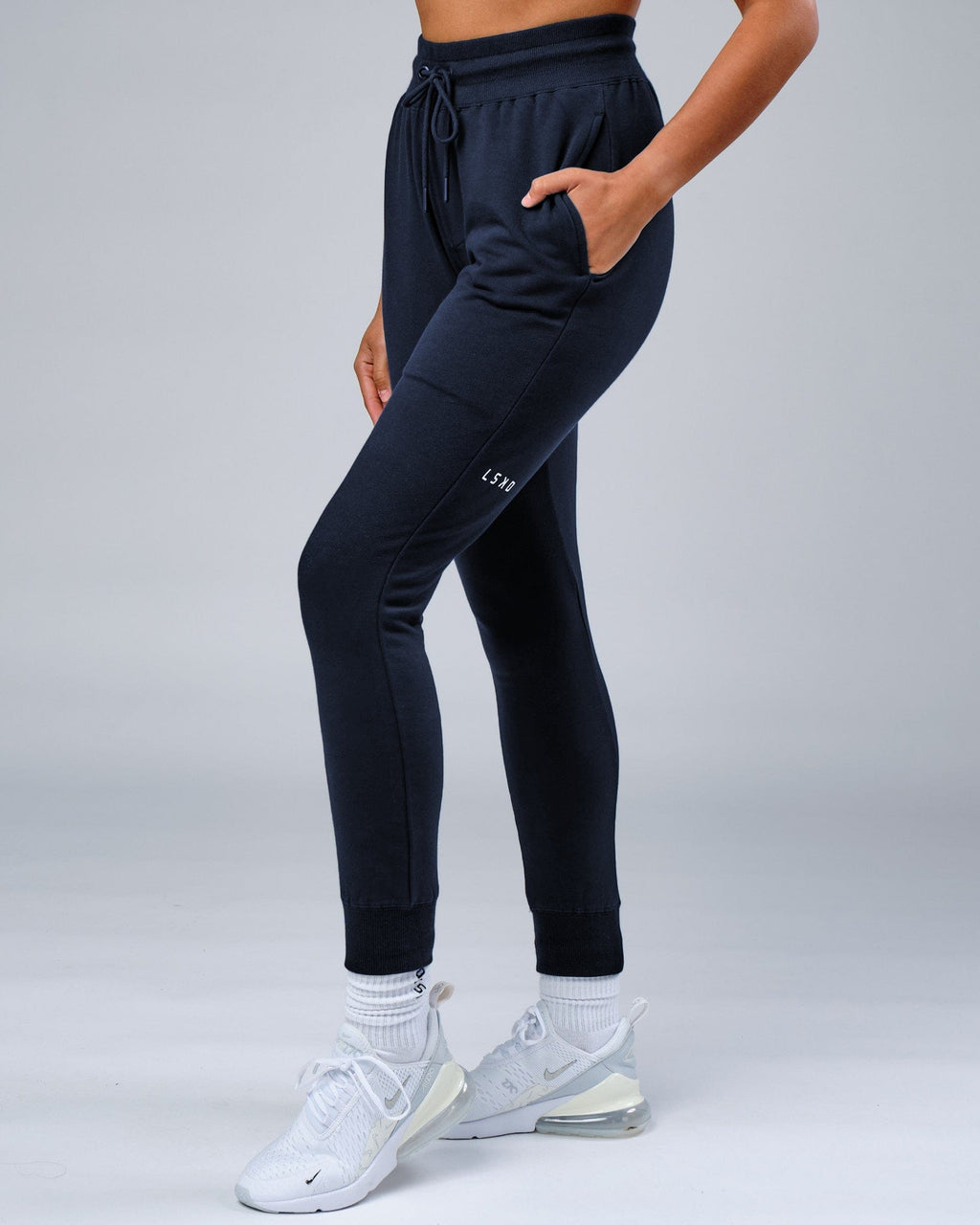 Model wearing Unisex Rival FLXFleece Track Pant - Carbon