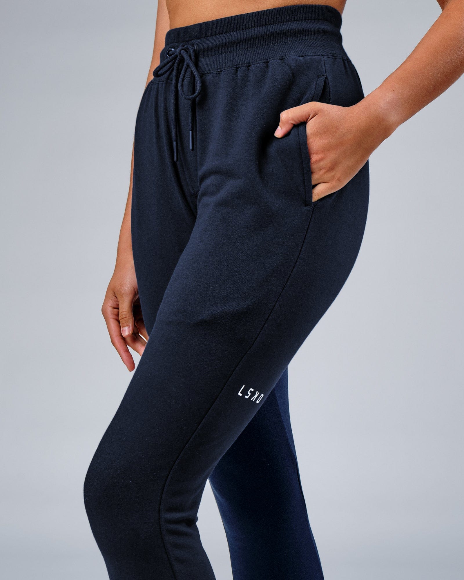 Model wearing Unisex Rival FLXFleece Track Pant - Carbon