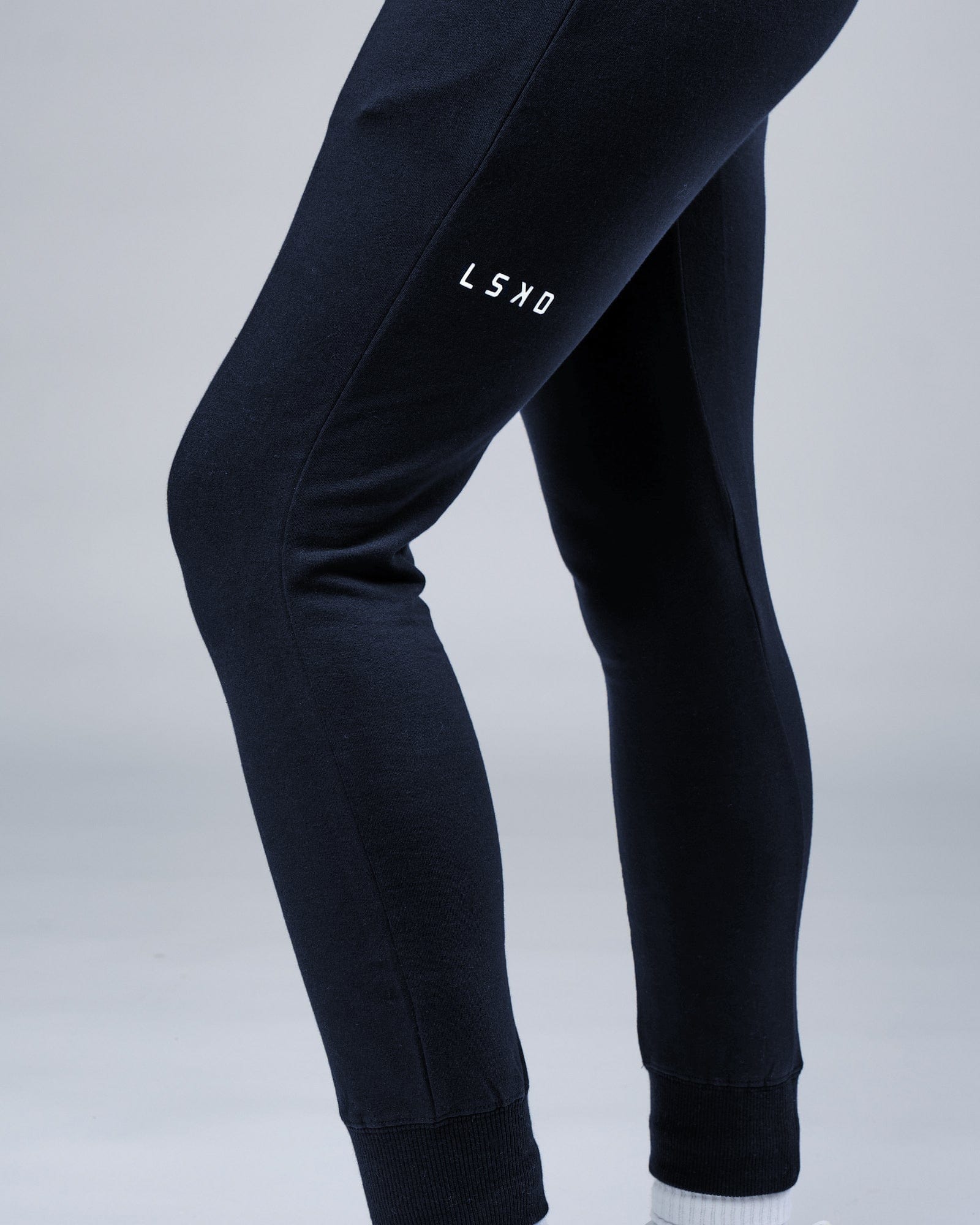 Model wearing Unisex Rival FLXFleece Track Pant - Carbon