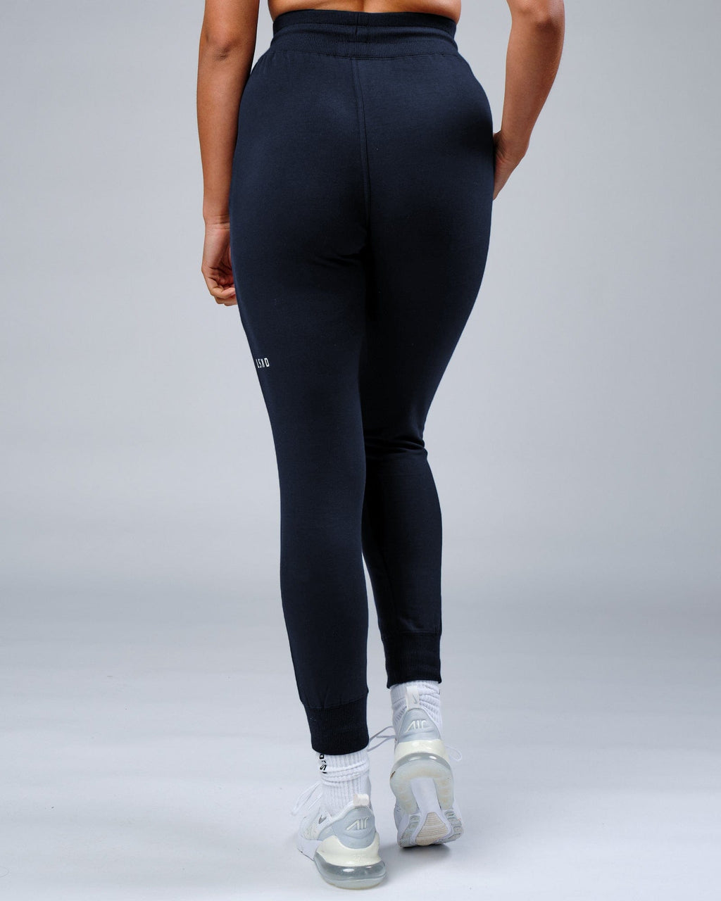 Model wearing Unisex Rival FLXFleece Track Pant - Carbon